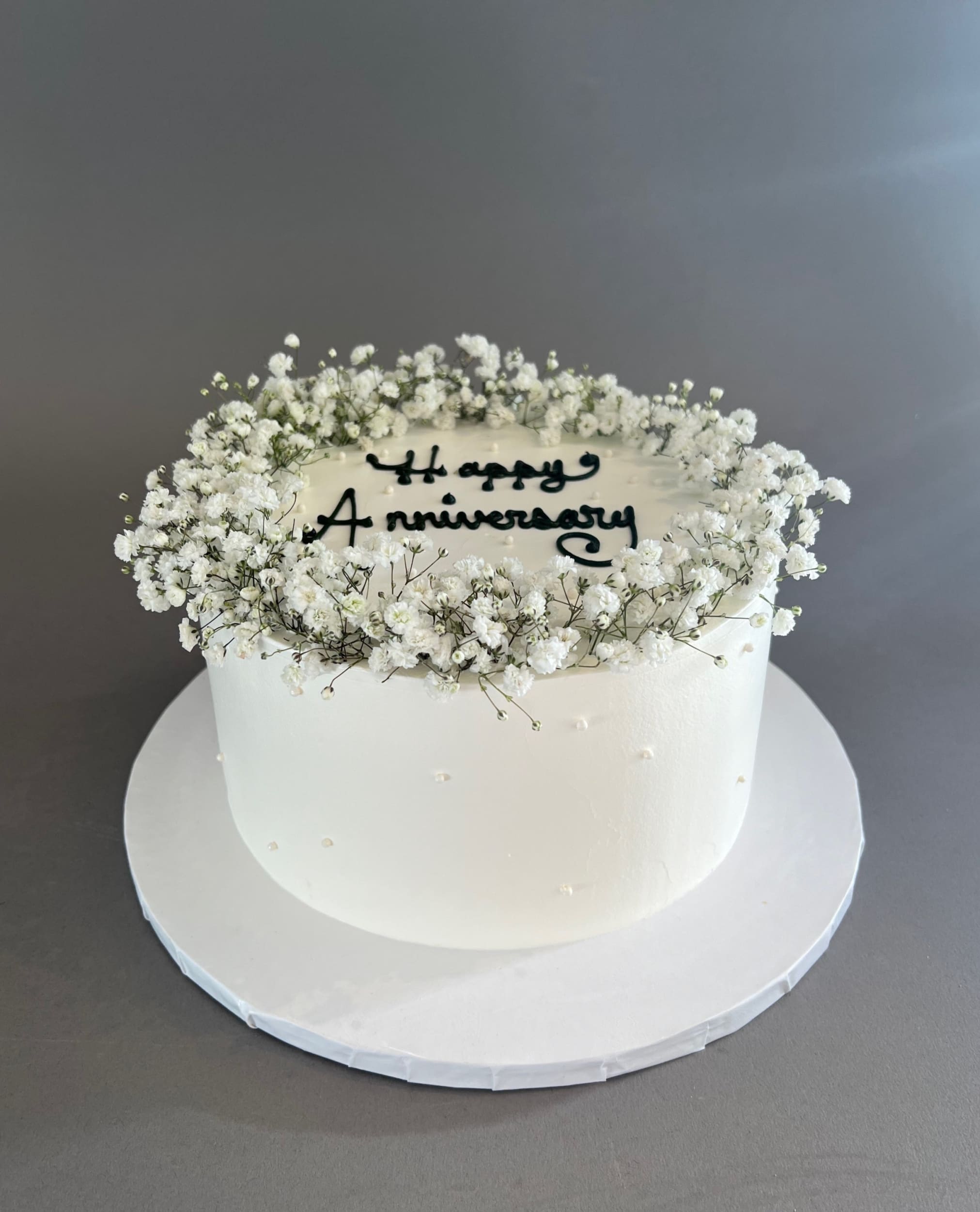 Baby’s breath on whipped cream - custom cake