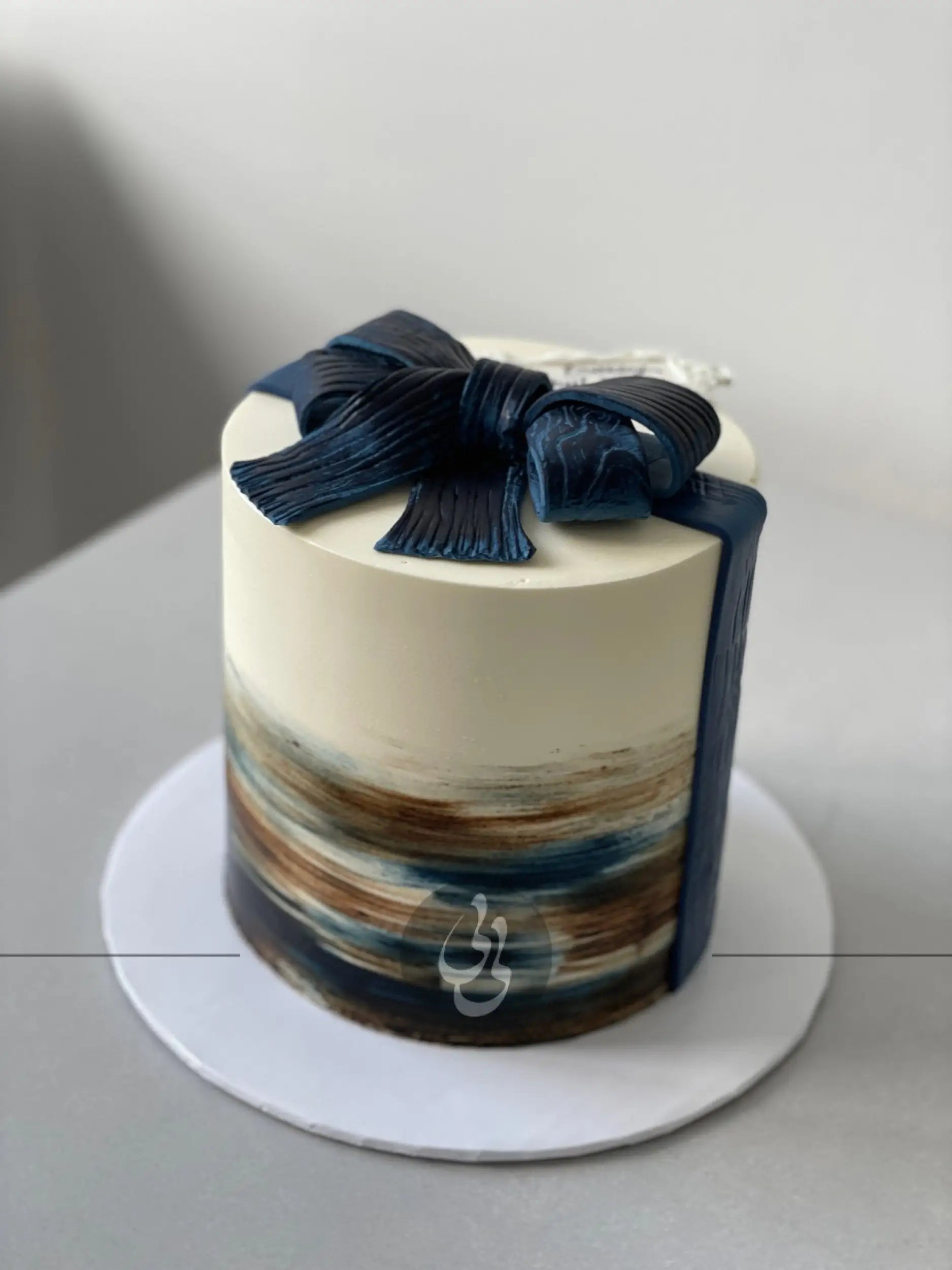 Buttercream brushstroke & bow cake - custom cake