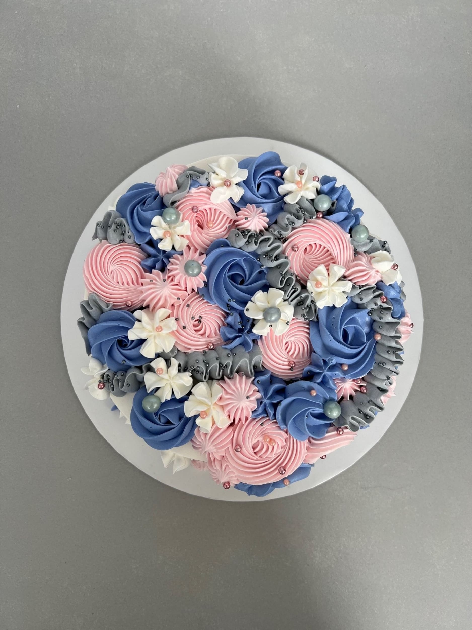 Cascading rosettes in whipped cream - custom cake