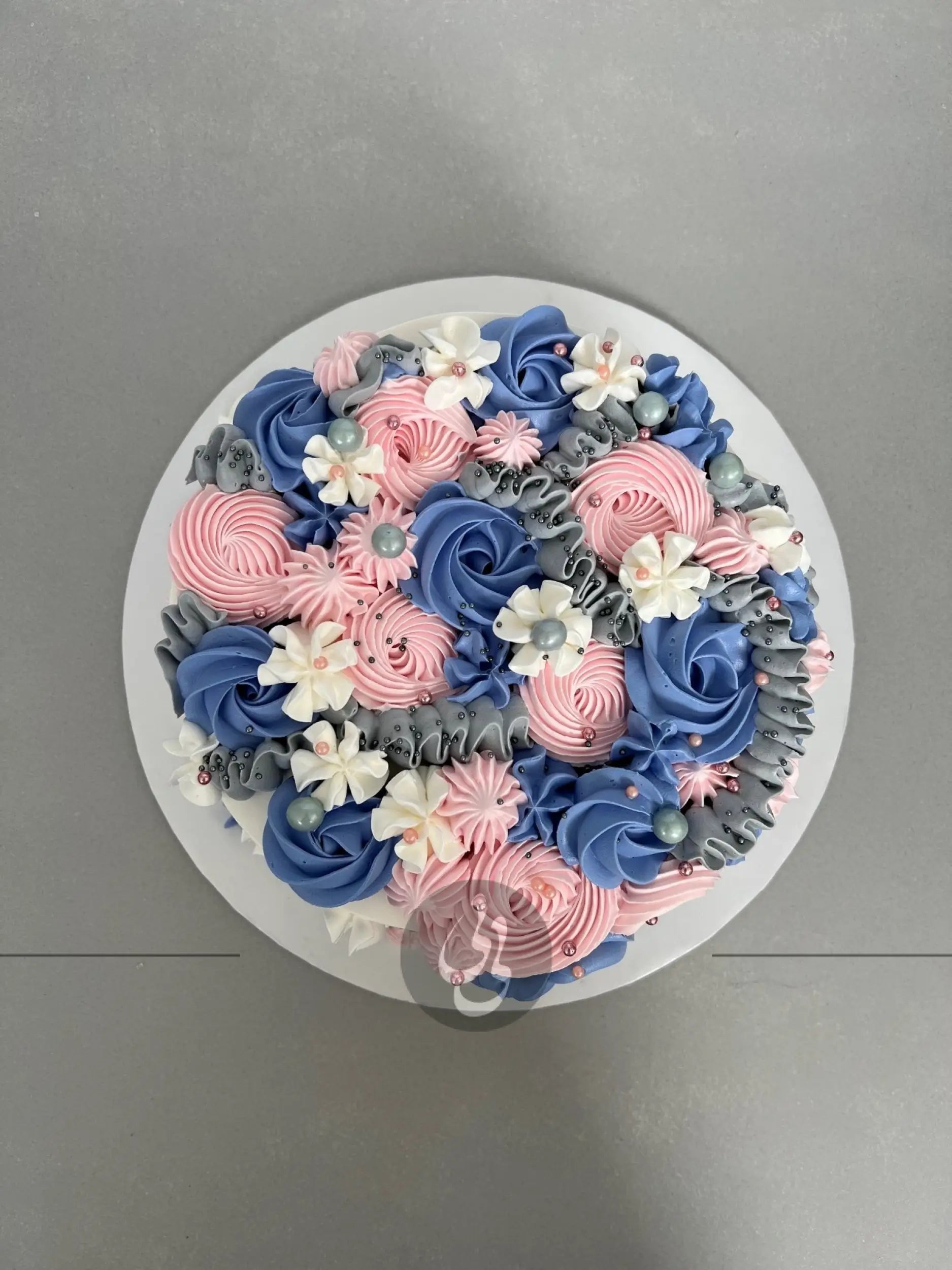 Cascading rosettes in whipped cream - custom cake