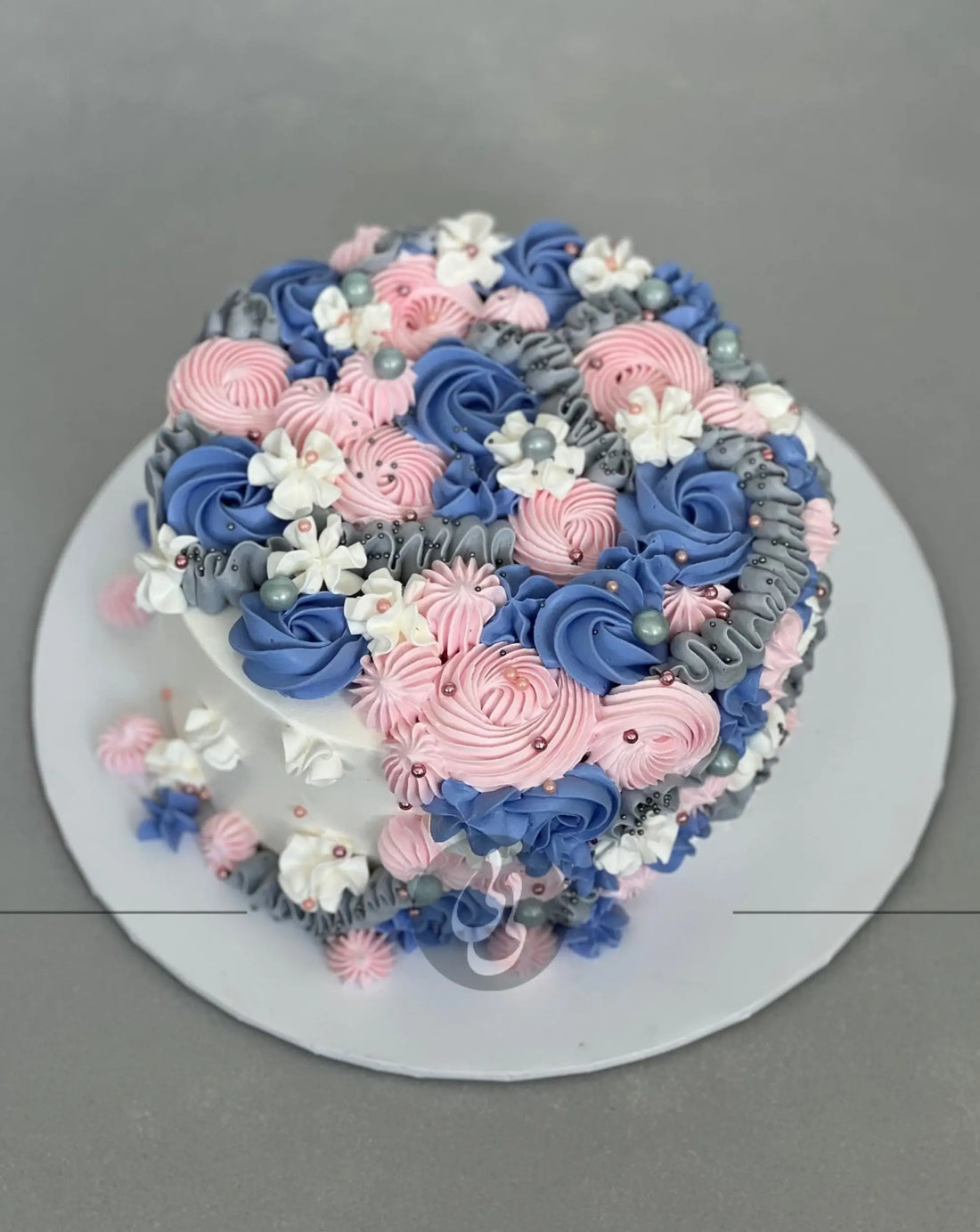 Cascading rosettes in whipped cream - custom cake