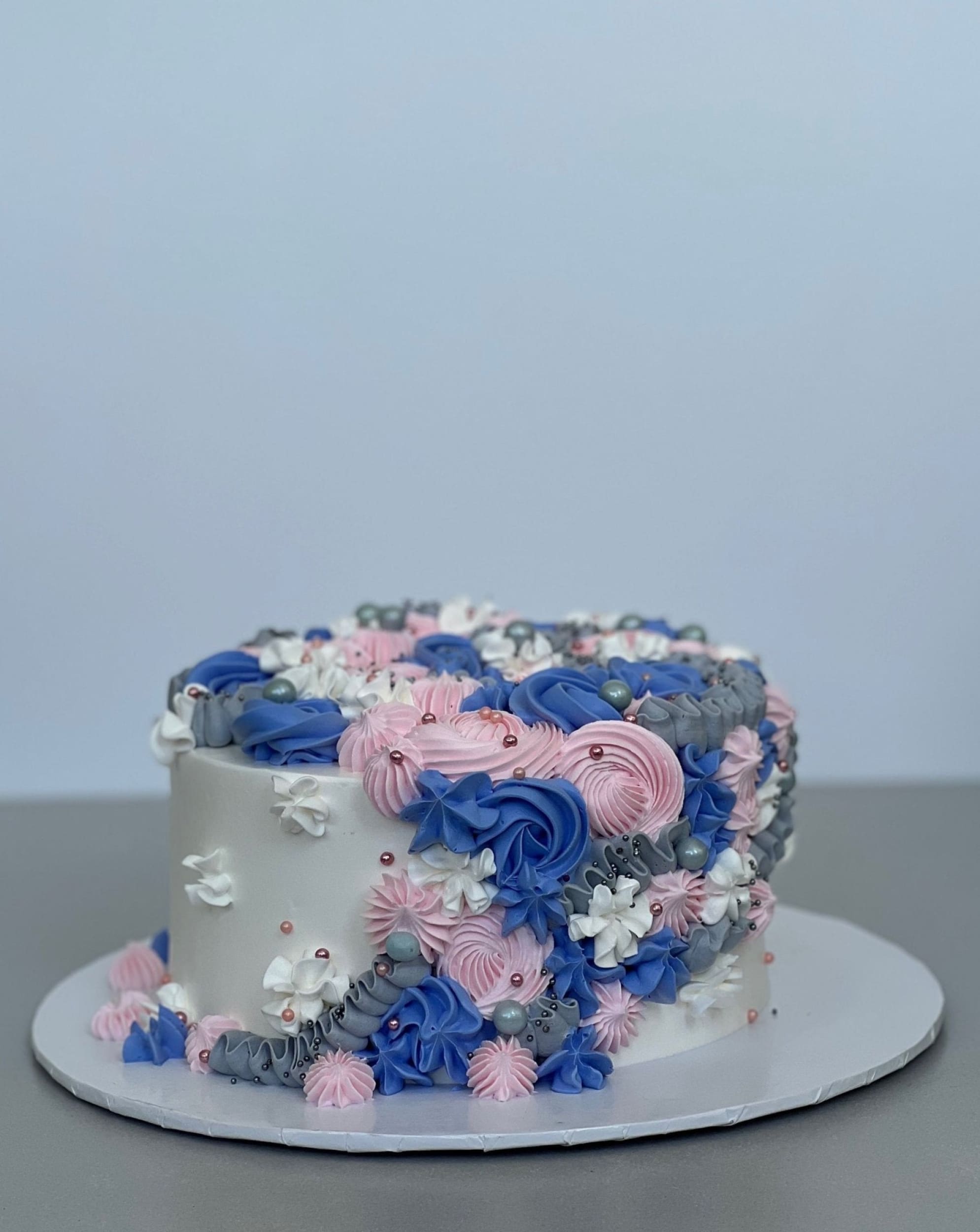 Cascading rosettes in whipped cream - custom cake