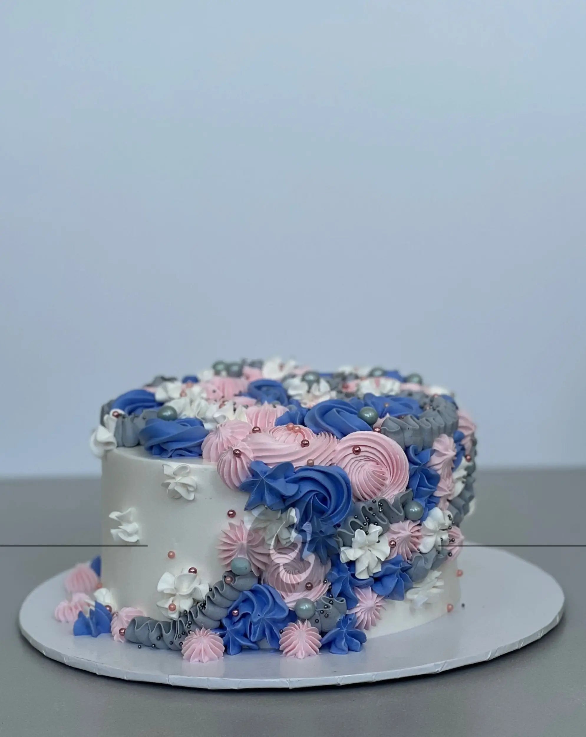 Cascading rosettes in whipped cream - custom cake