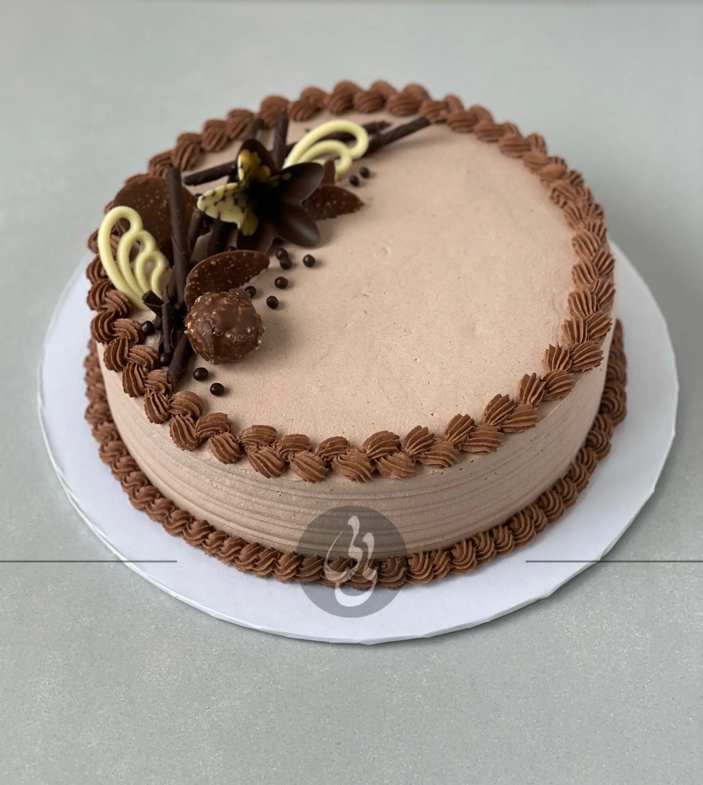 Chocolate decorations on whipped cream - custom cake