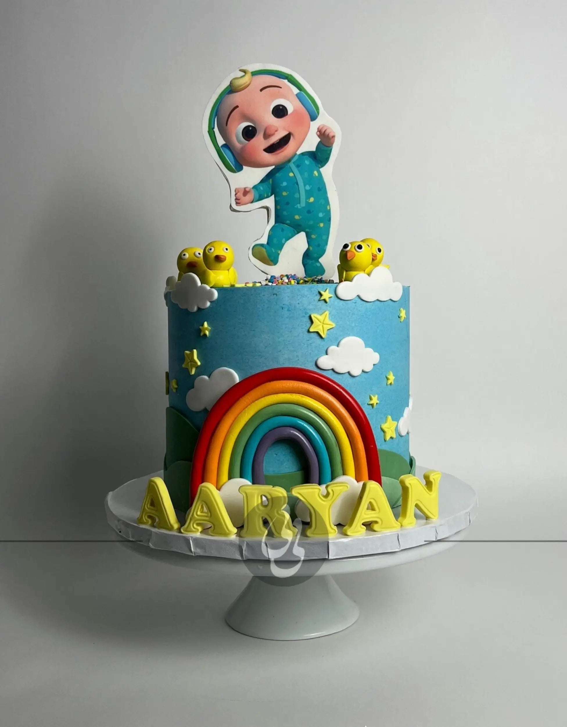 Cocomelon jj & rainbow in edible print - custom cake