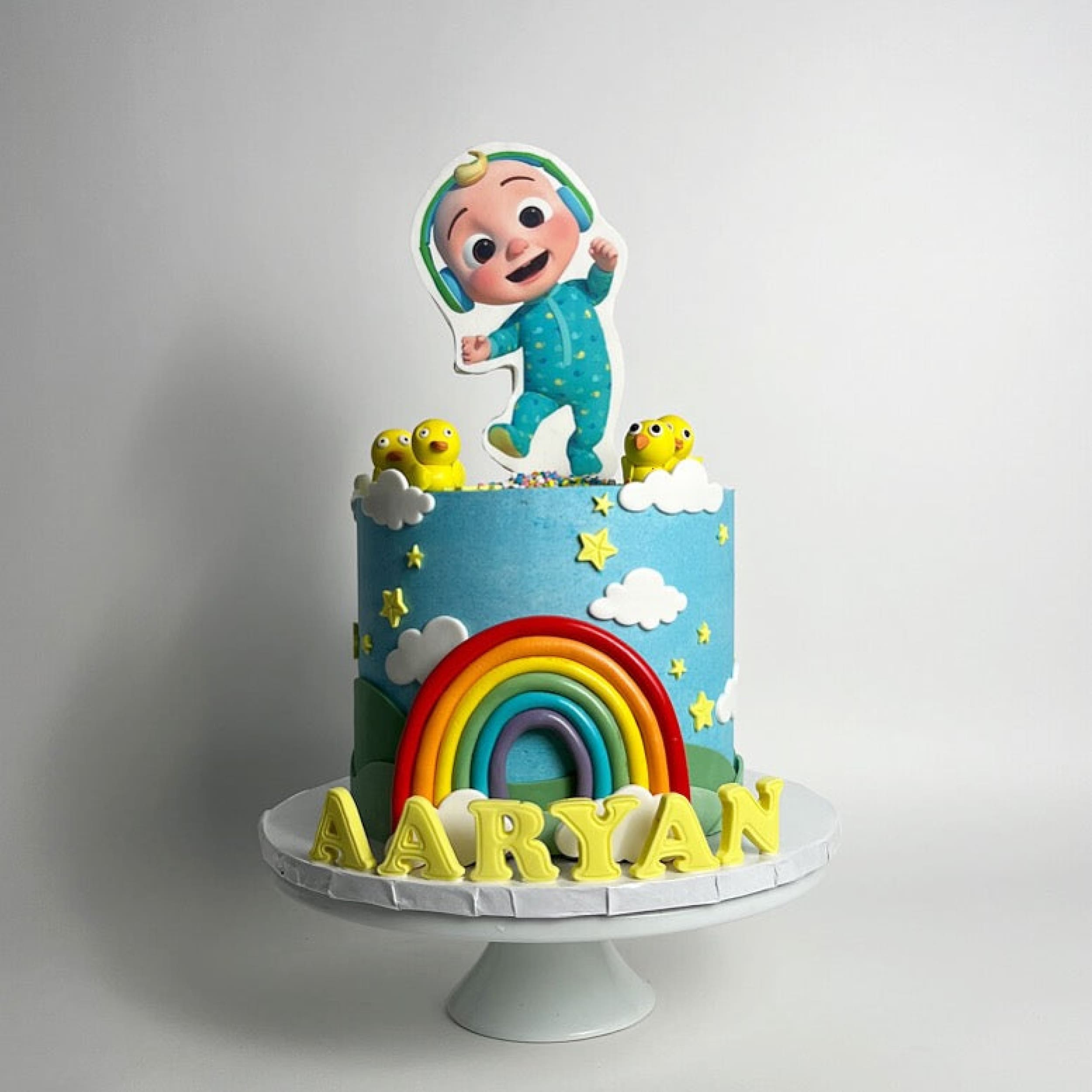 Cocomelon jj & rainbow in edible print - custom cake