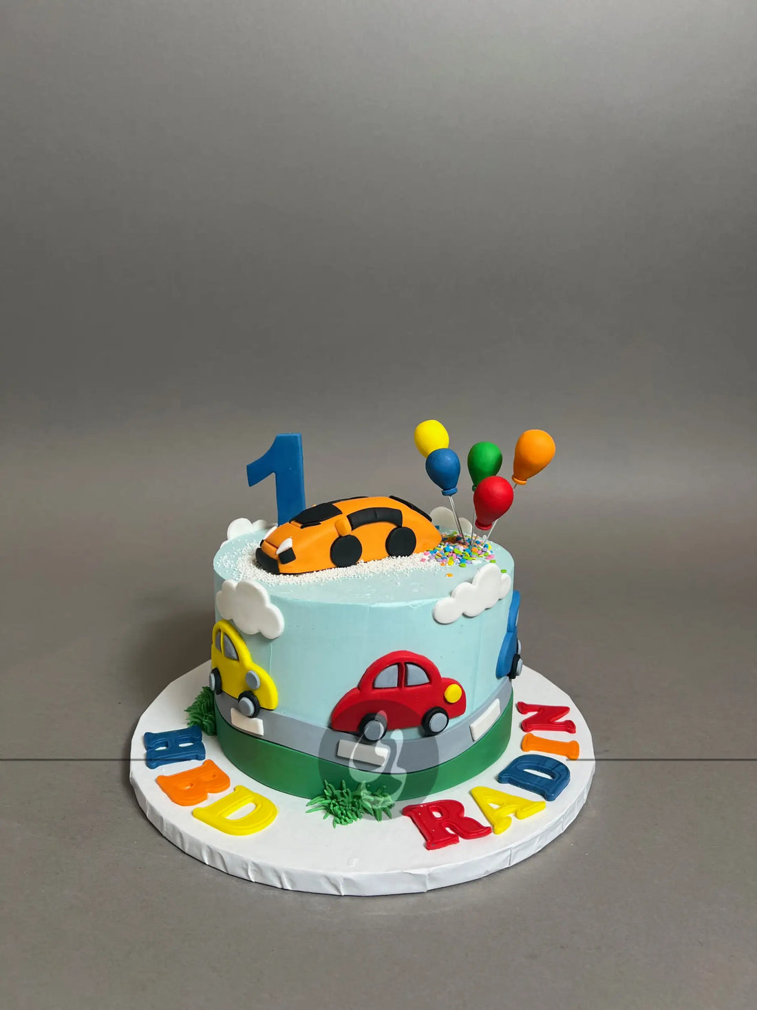 Colourful cars on buttercream - custom cake