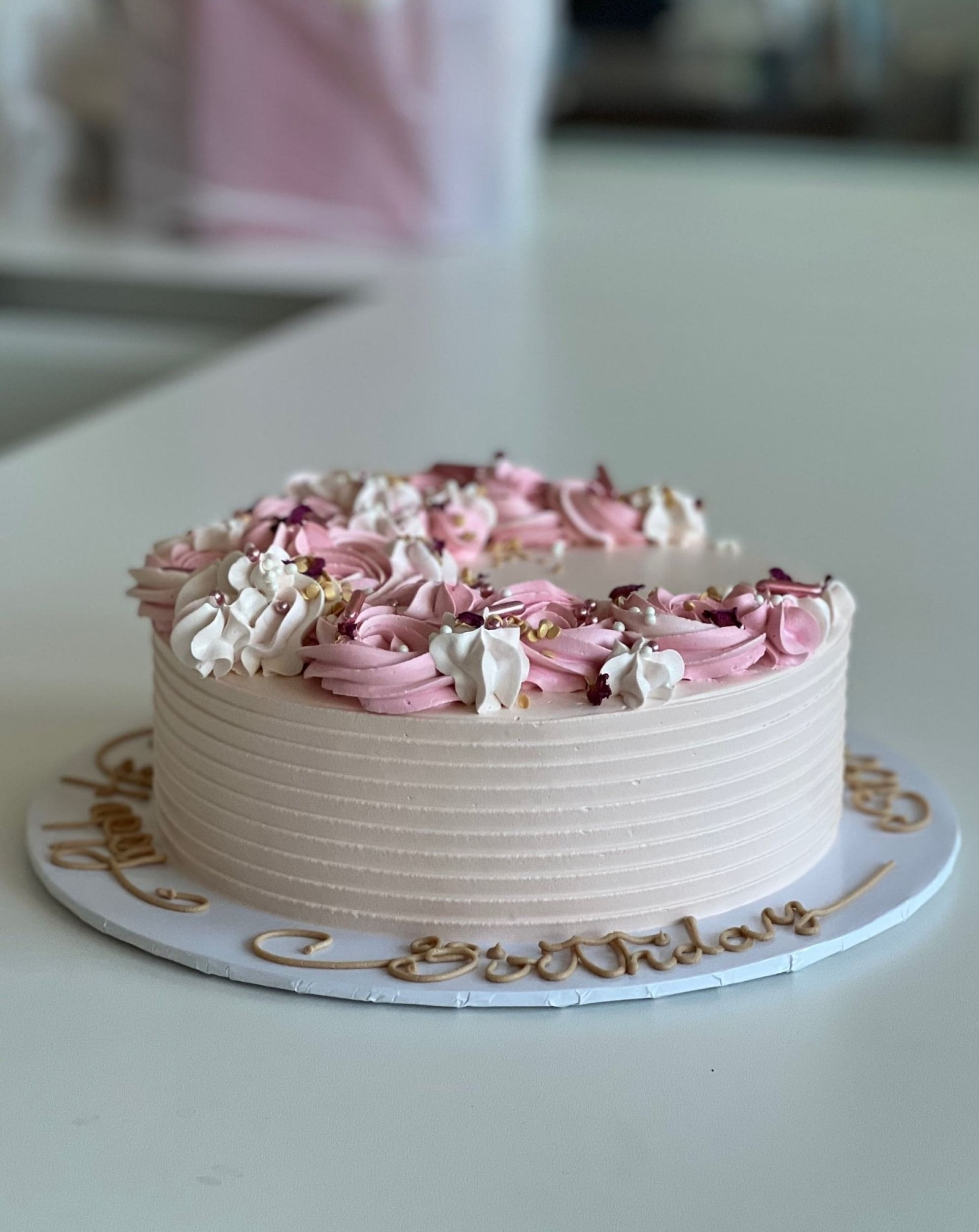 Crescent moon rosettes in whipped cream - custom cake