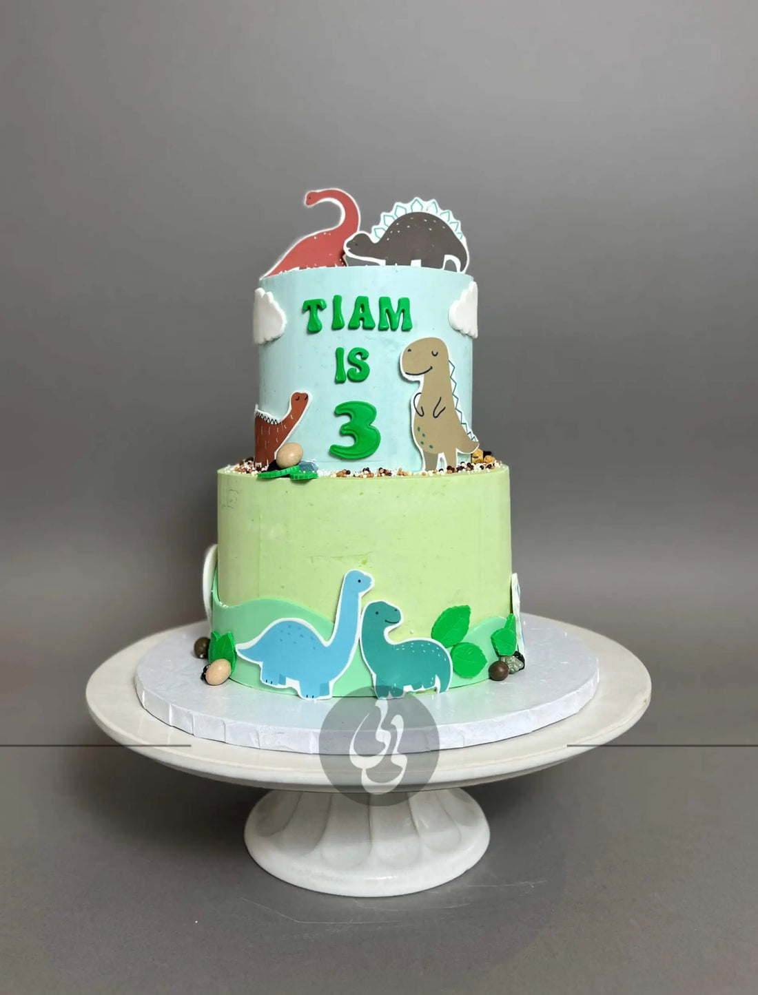 Dinosaur images on buttercream - custom cake