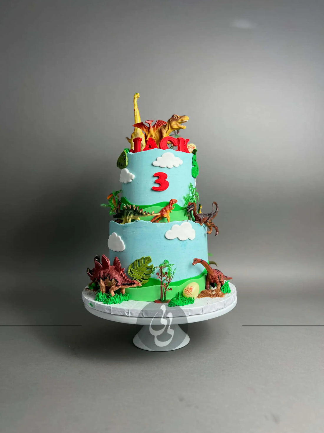 Dinosaur toys on buttercream - custom cake
