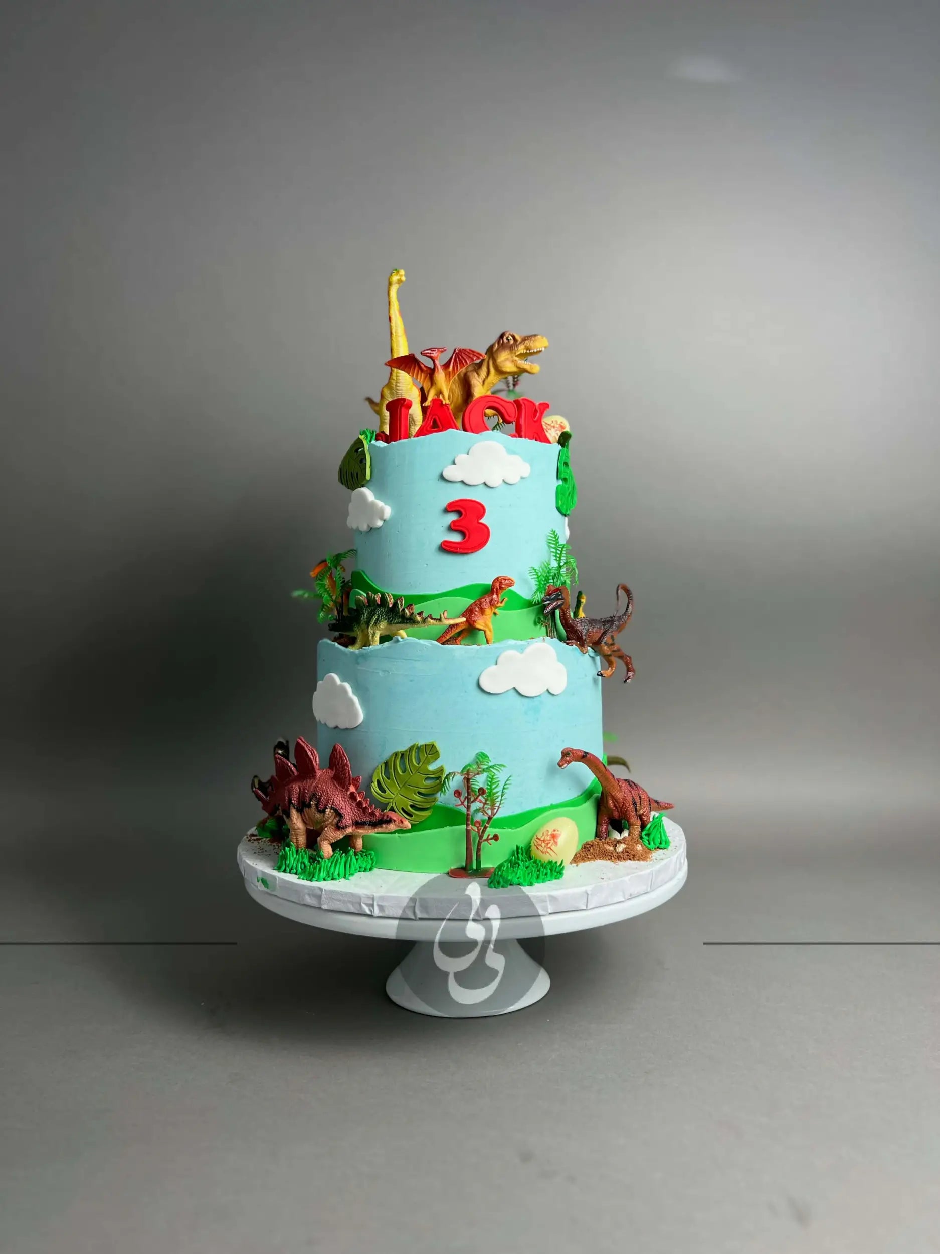 Dinosaur toys on buttercream - custom cake
