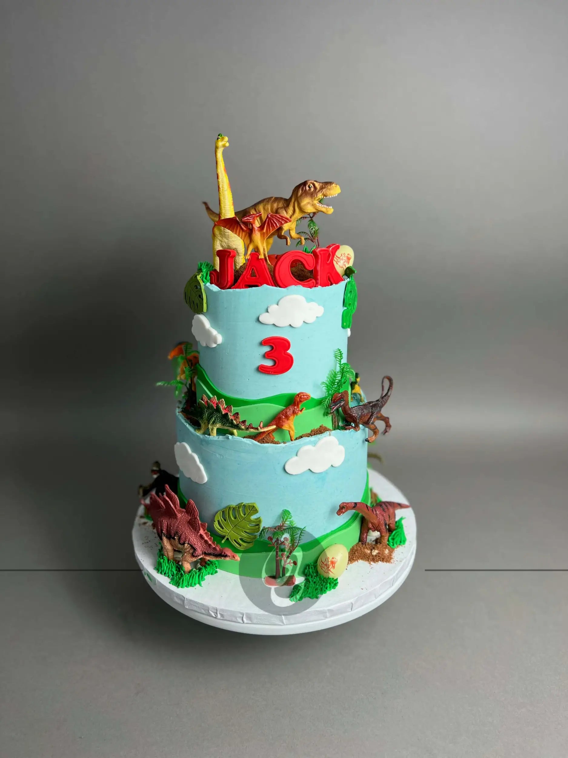 Dinosaur toys on buttercream - custom cake