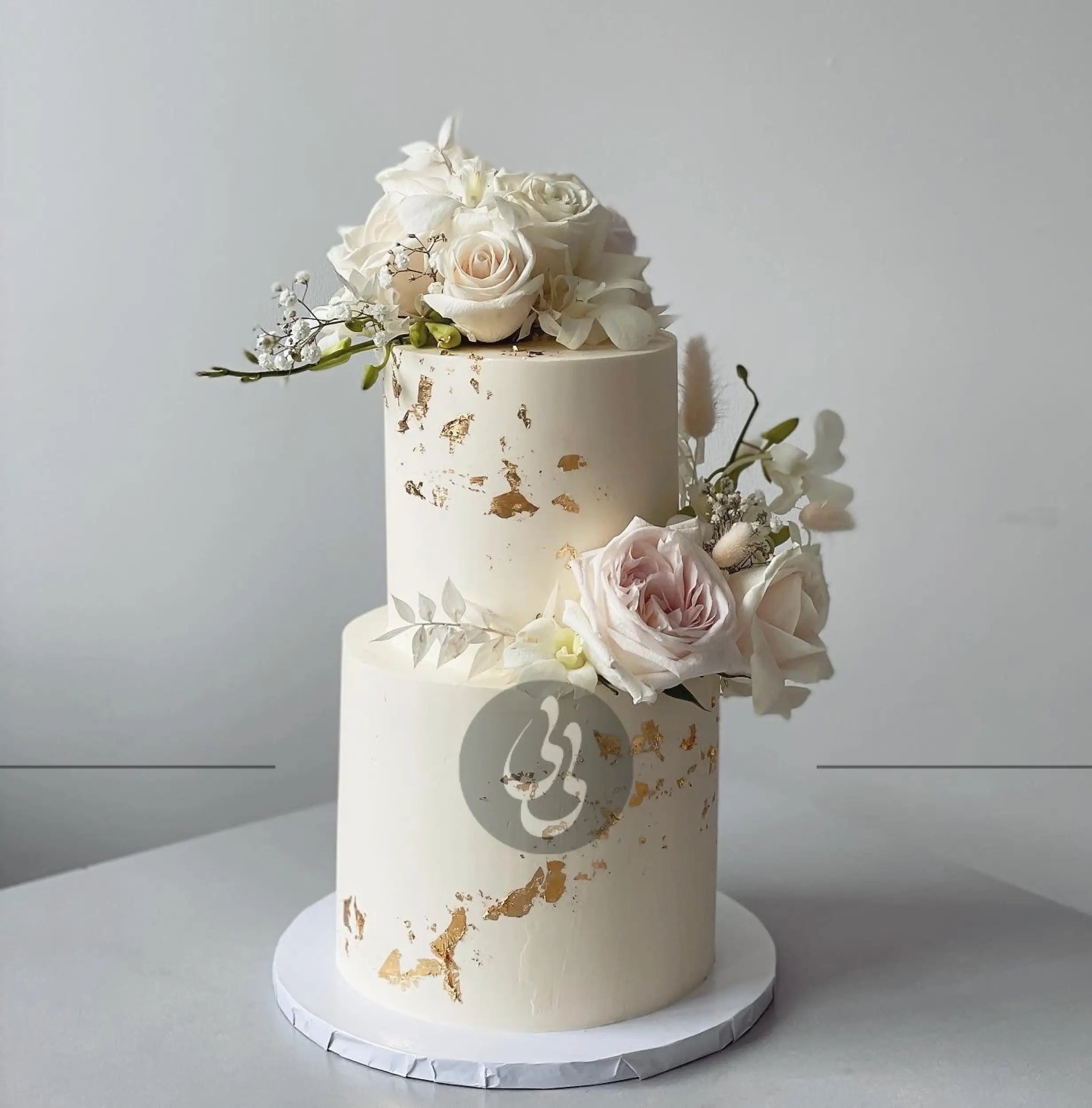 Fresh blooms on buttercream - wedding cake