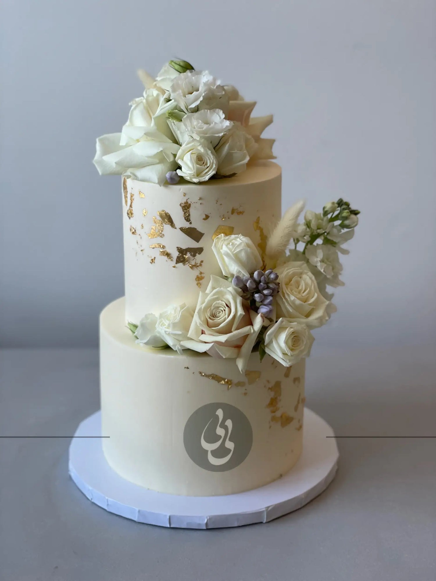 Fresh blooms on buttercream - wedding cake