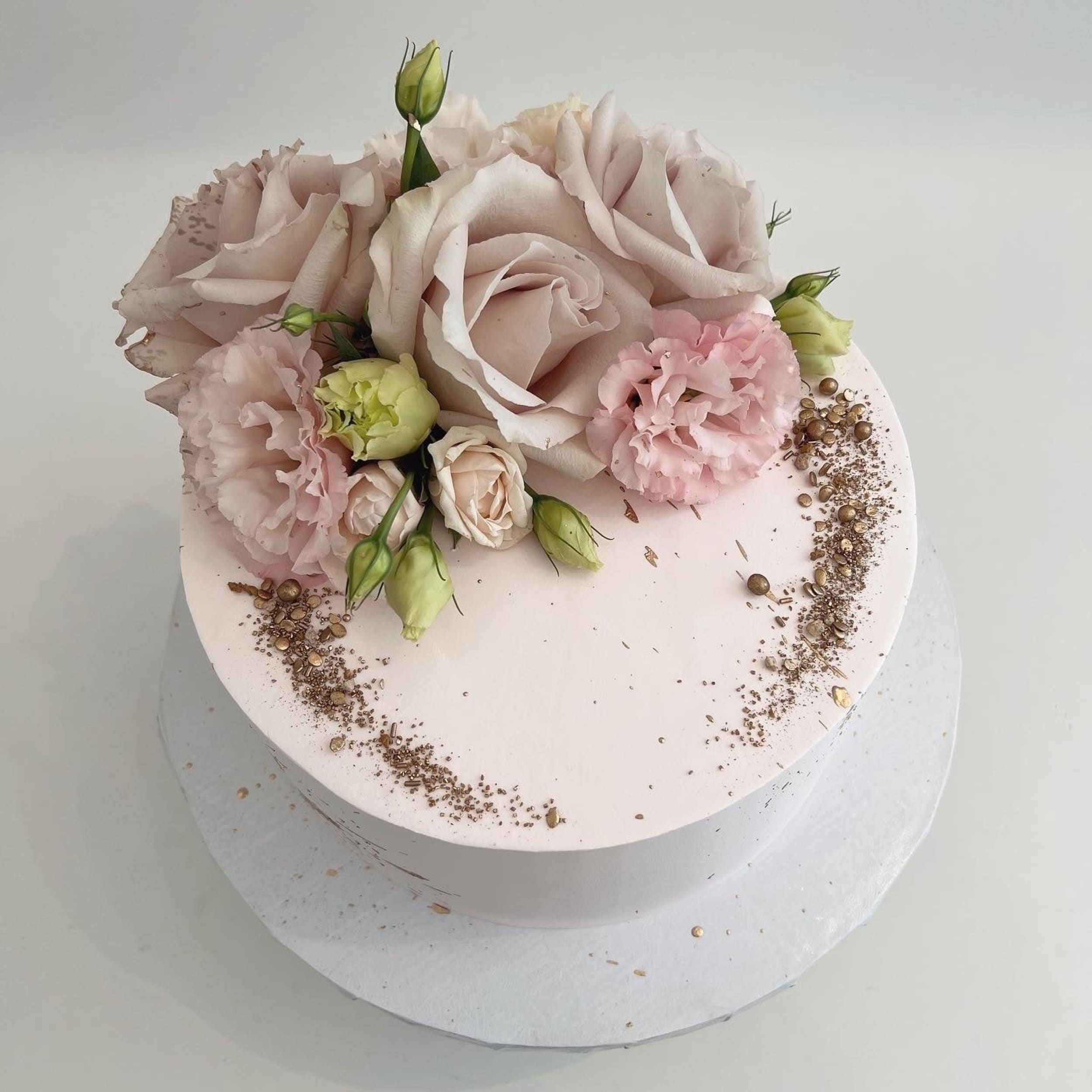 Fresh blooms on whipped cream - custom cake