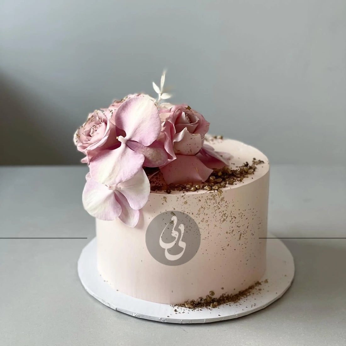 Fresh blooms on whipped cream - custom cake