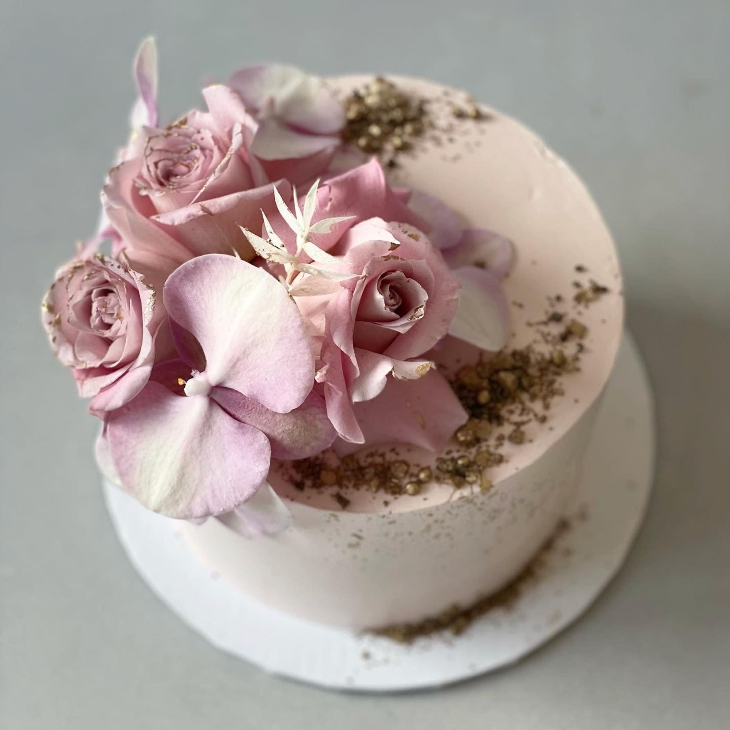 Fresh blooms on whipped cream - custom cake