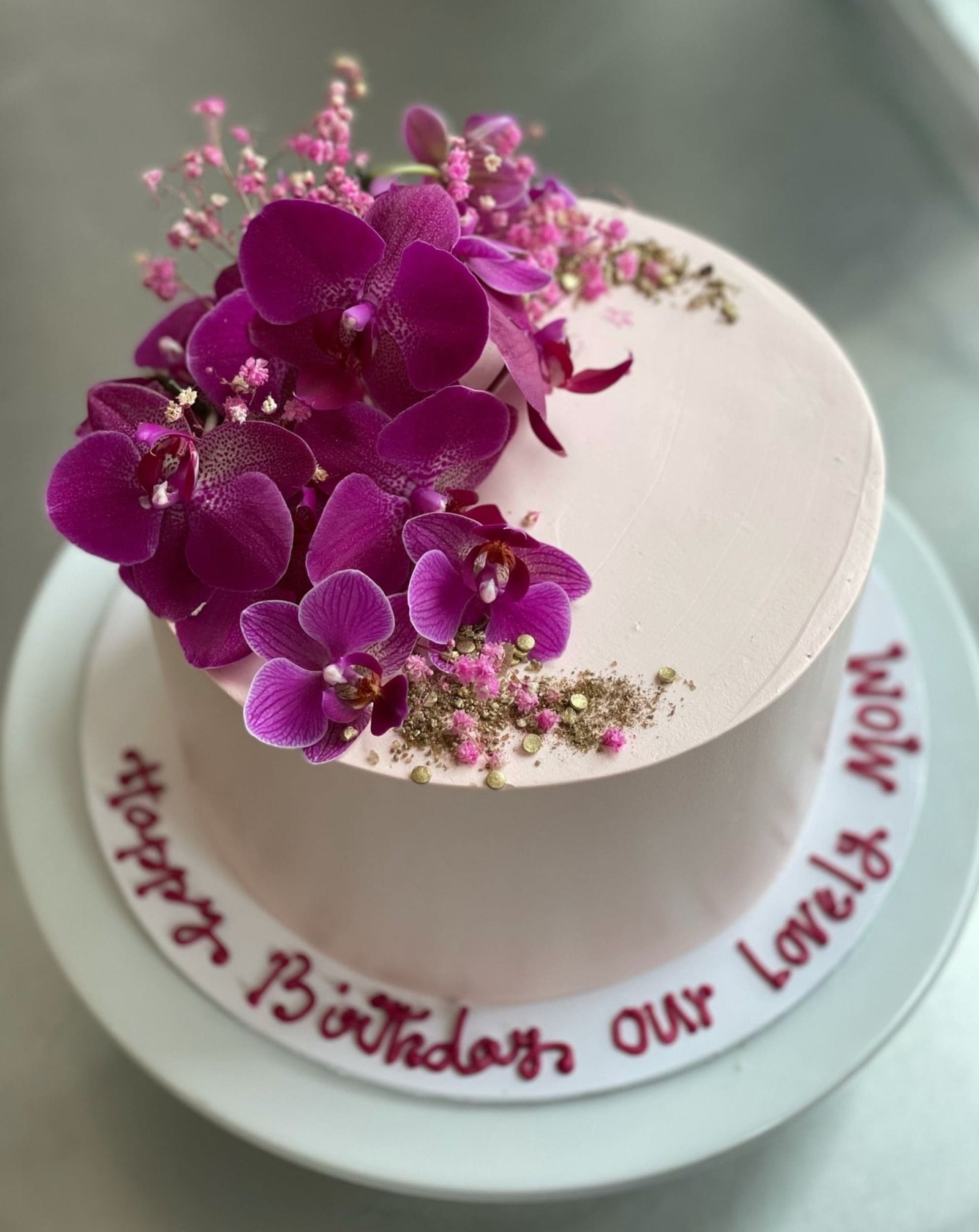 Fresh blooms on whipped cream - custom cake