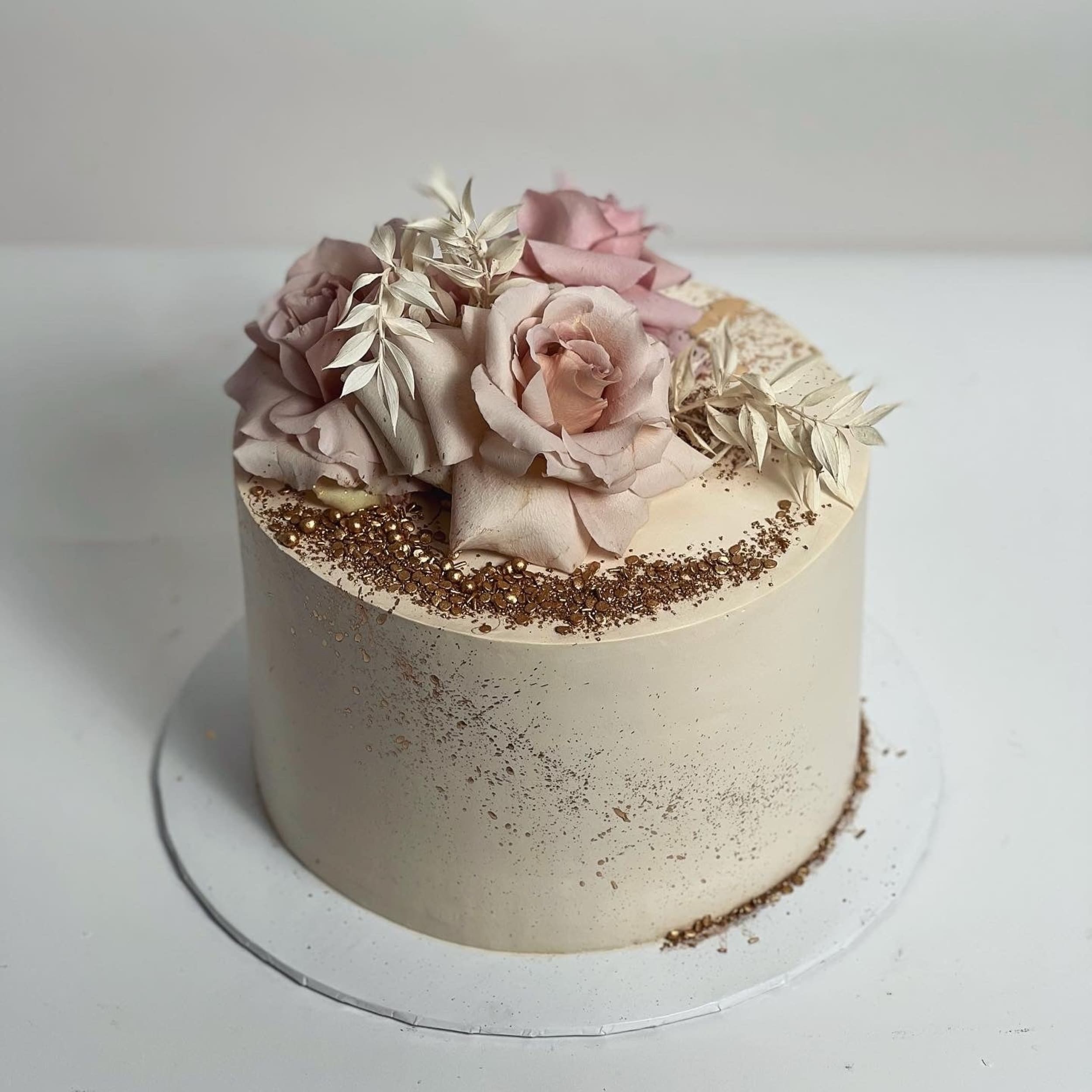 Fresh blooms on whipped cream - custom cake