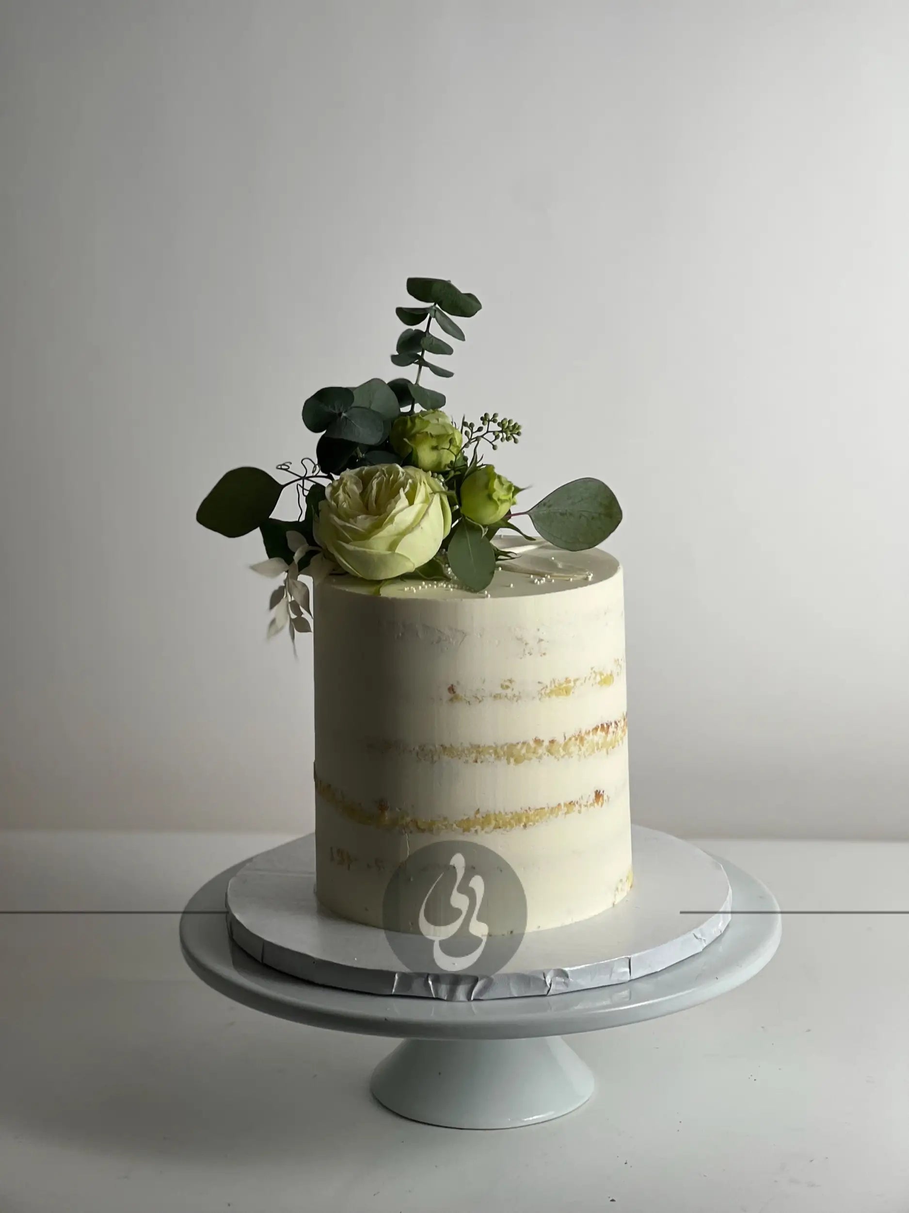 Fresh flowers on semi-naked buttercream - custom cake