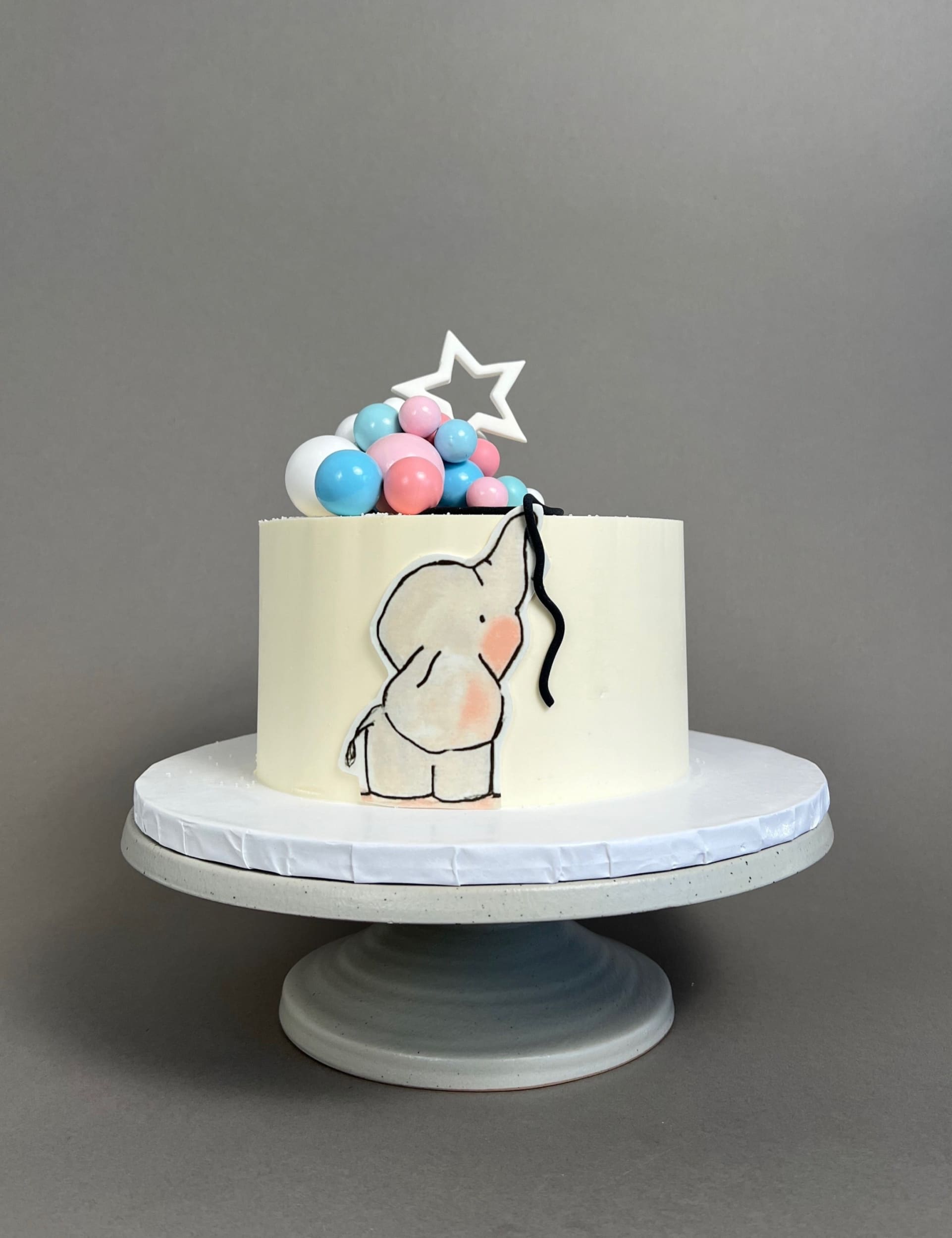 Gender reveal baby animal & spheres - custom cake