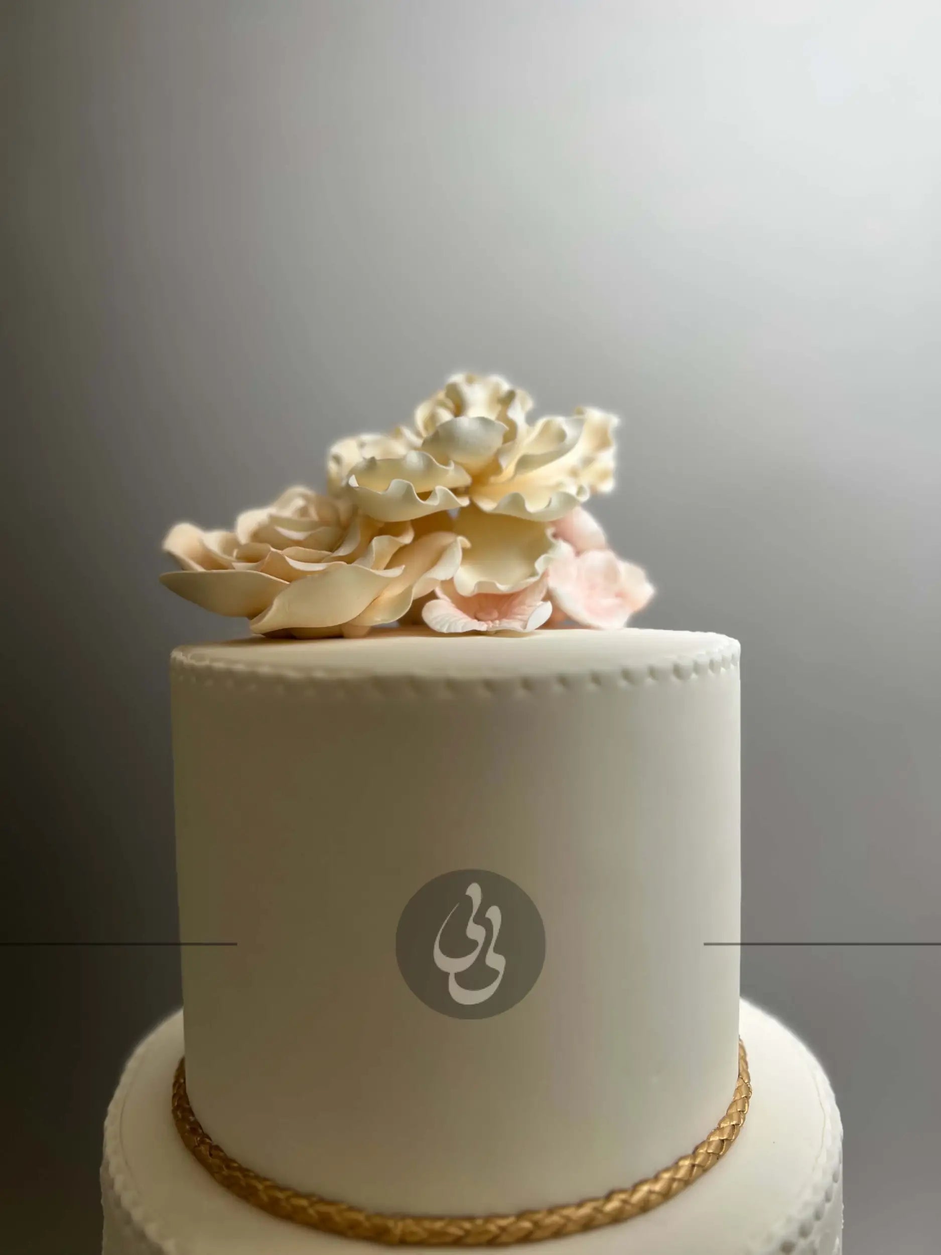 Gold rope and sugar flowers - wedding cake