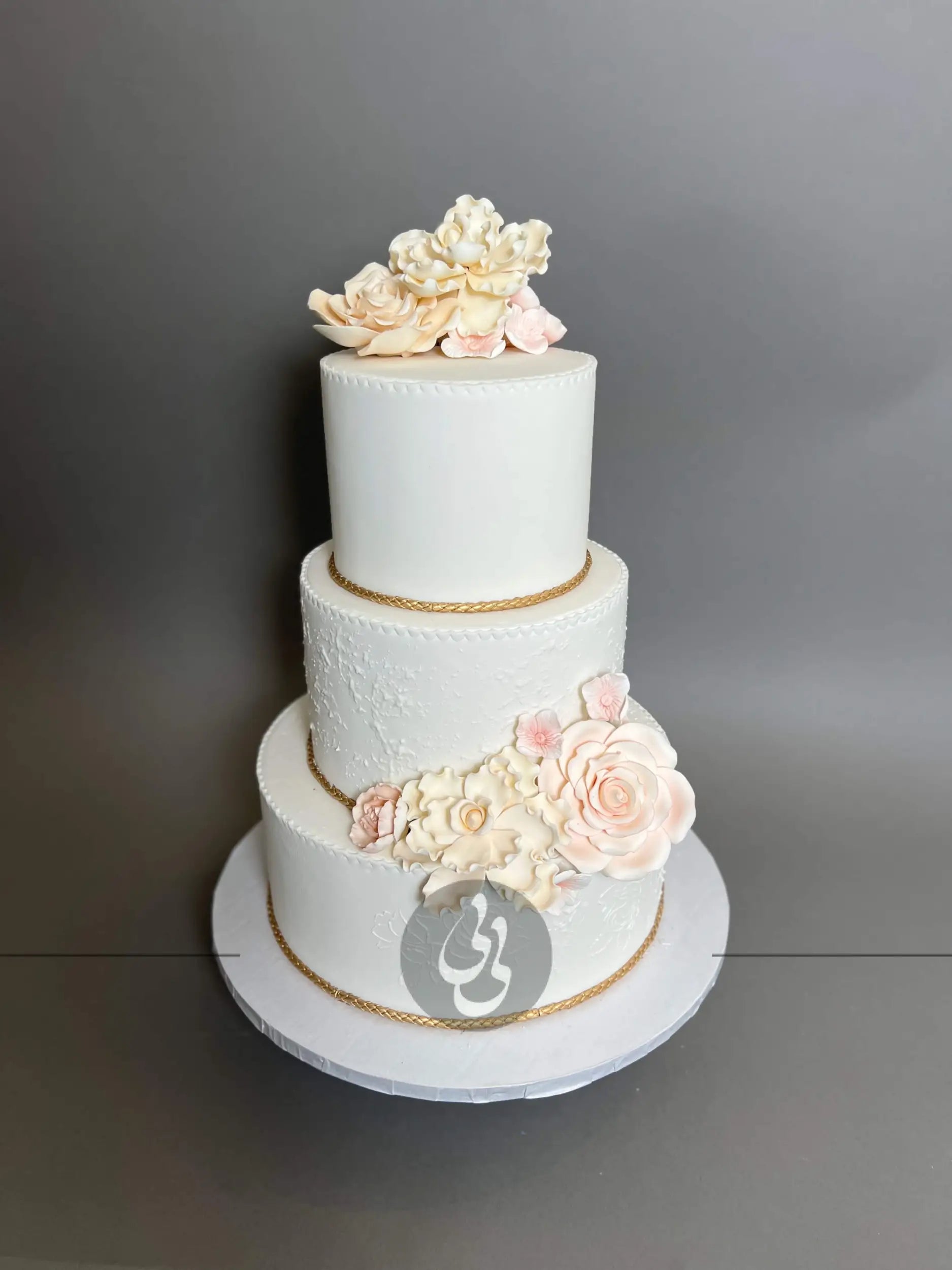 Gold rope and sugar flowers - wedding cake