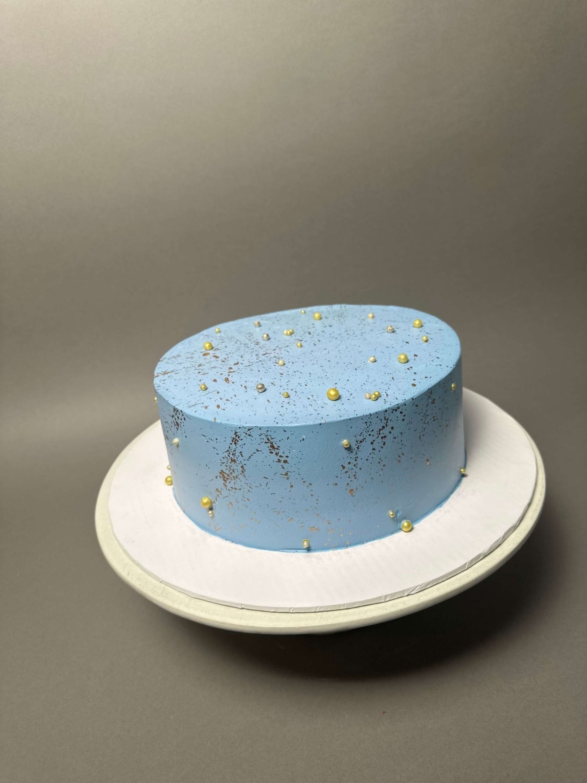 Gold splatter on whipped cream - custom cake