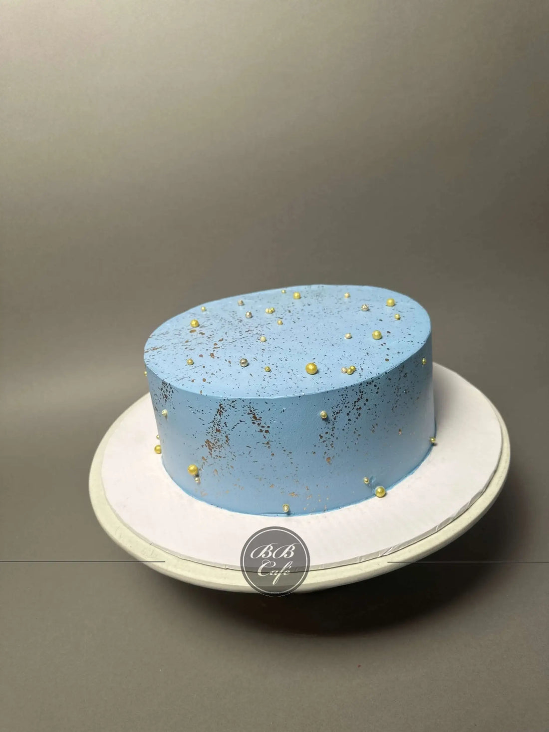 Gold splatter on whipped cream - custom cake