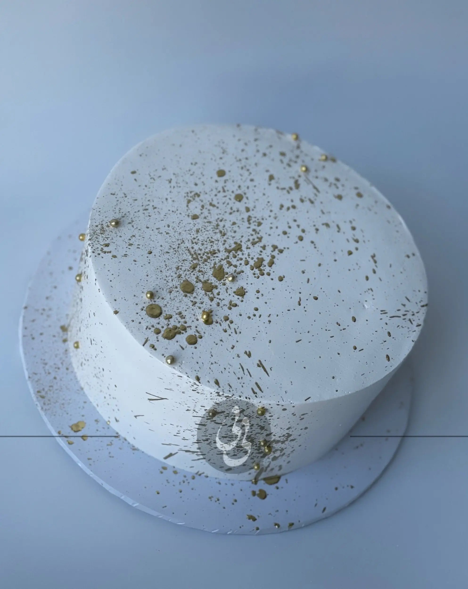 Gold splatter on whipped cream - custom cake