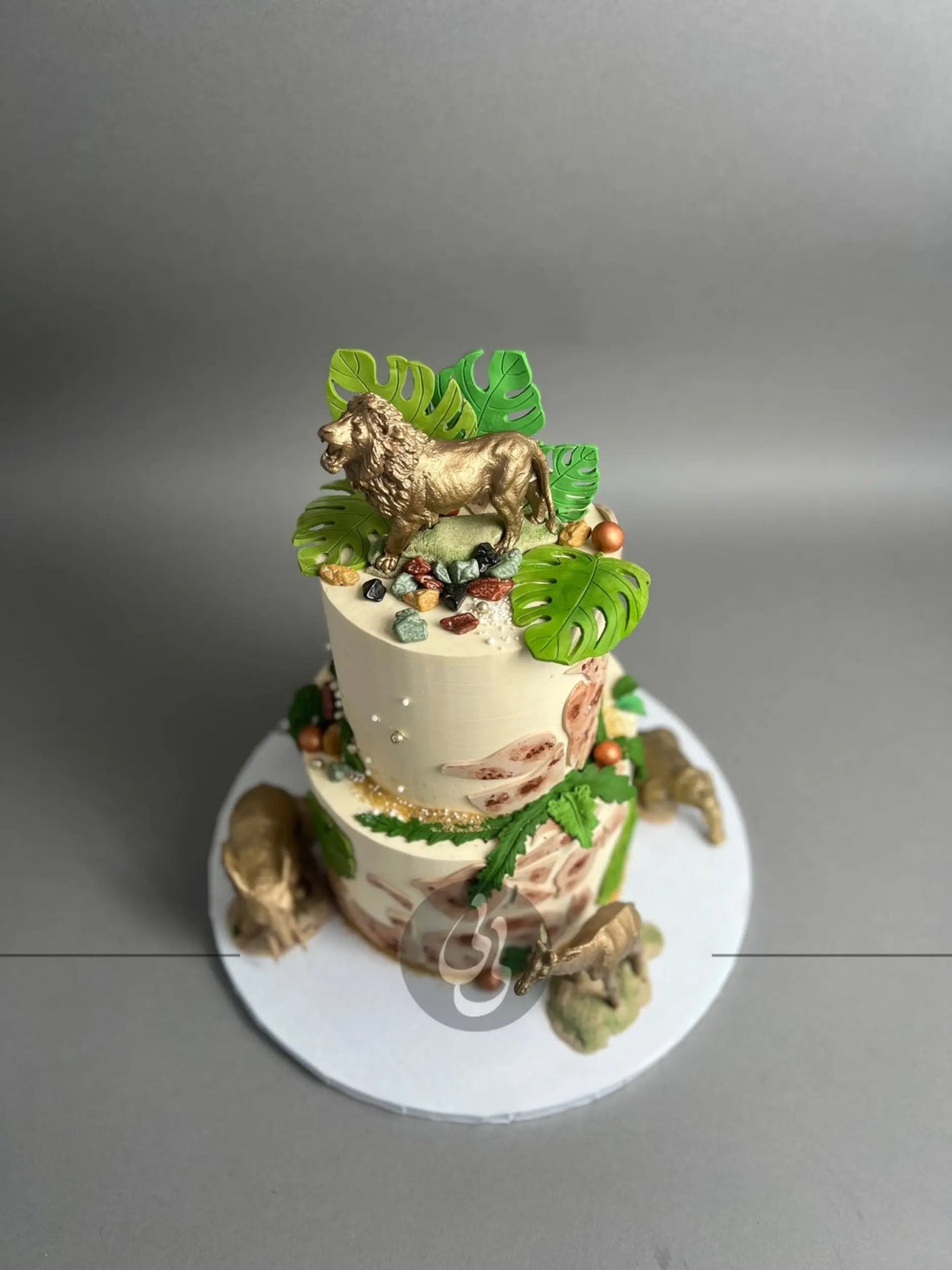 Golden safari animals on buttercream - custom cake