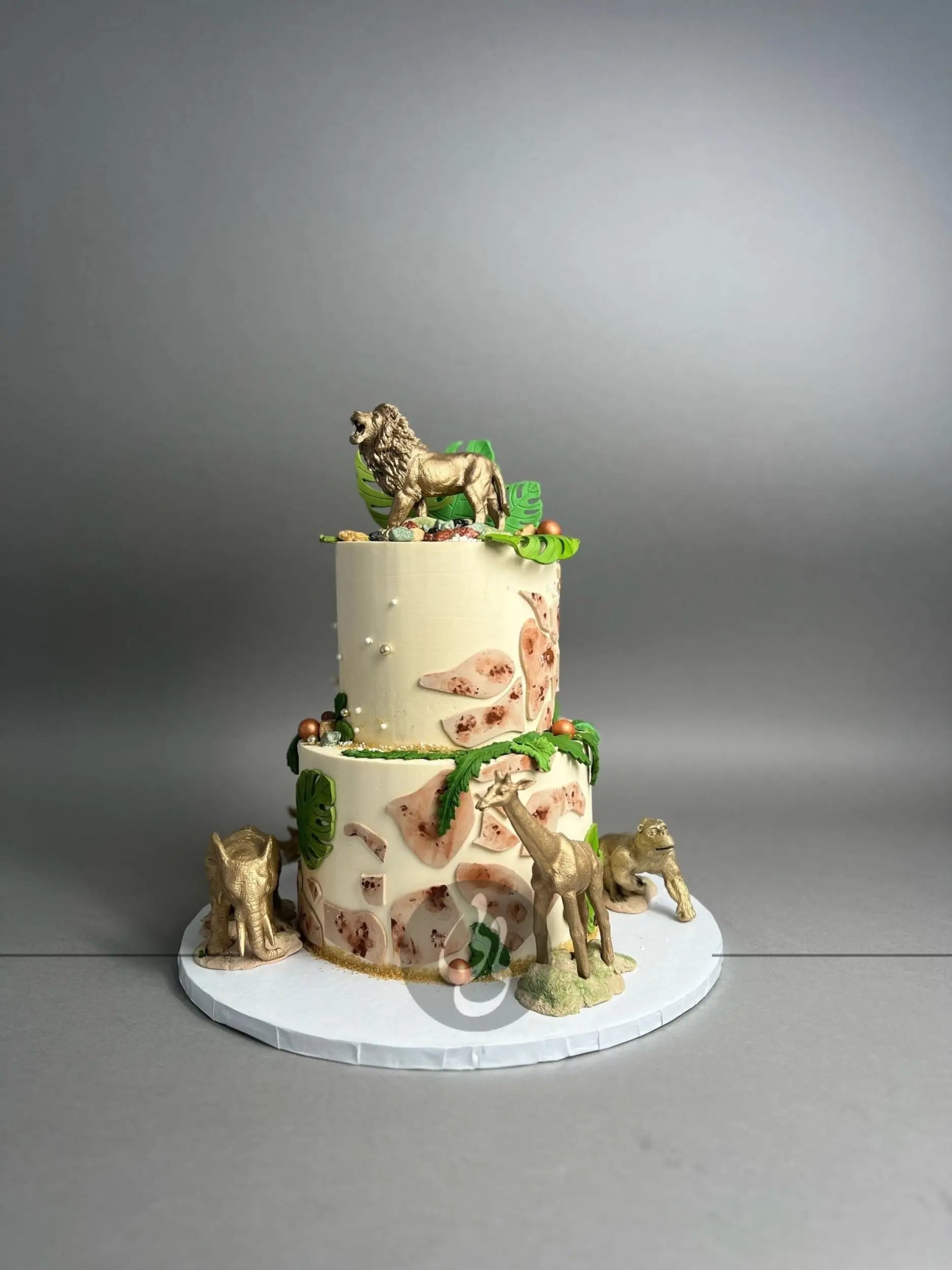 Golden safari animals on buttercream - custom cake
