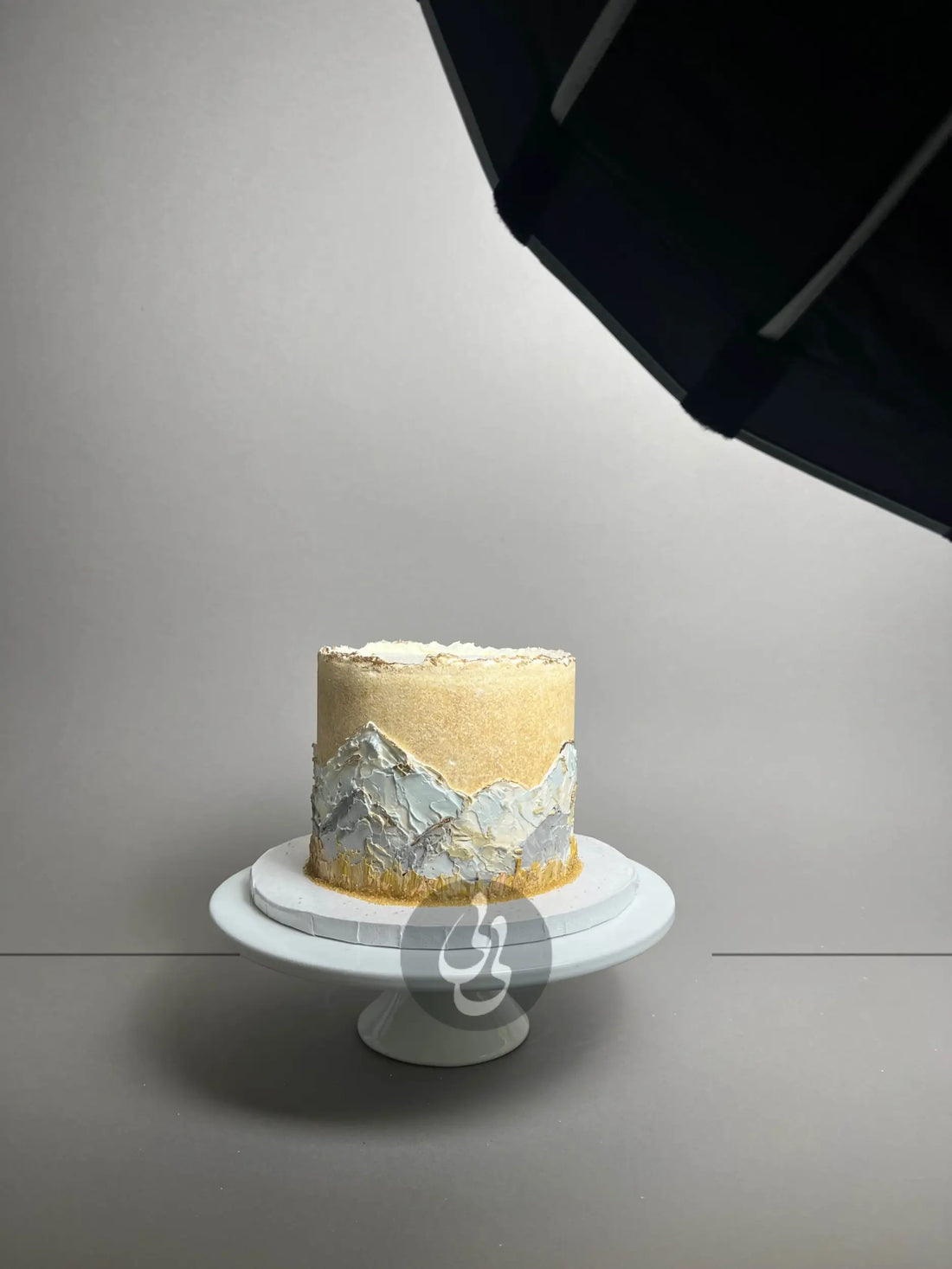 Hand painted mountain scenery on buttercream - custom cake