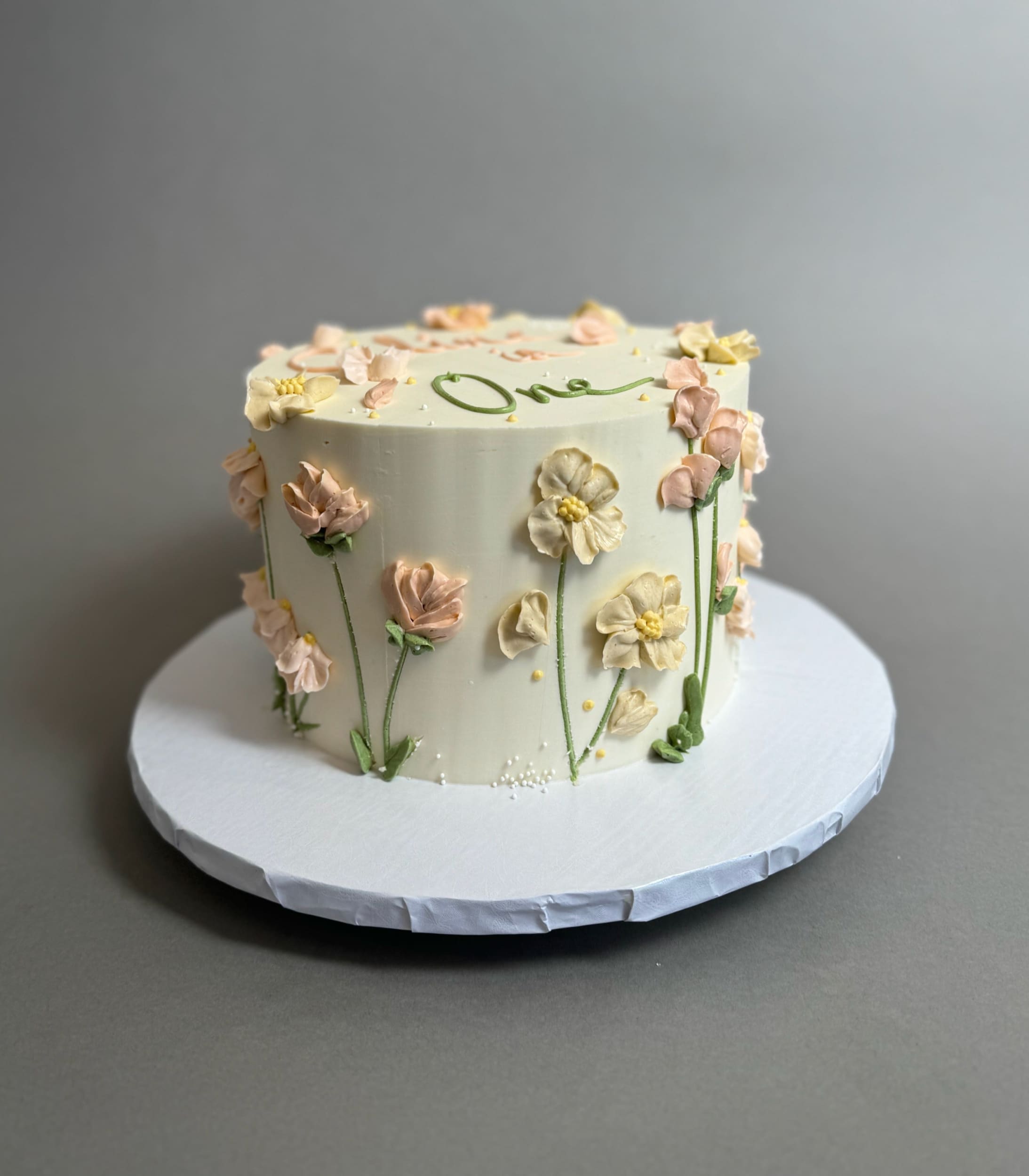 Hand piped flower meadow - custom cake