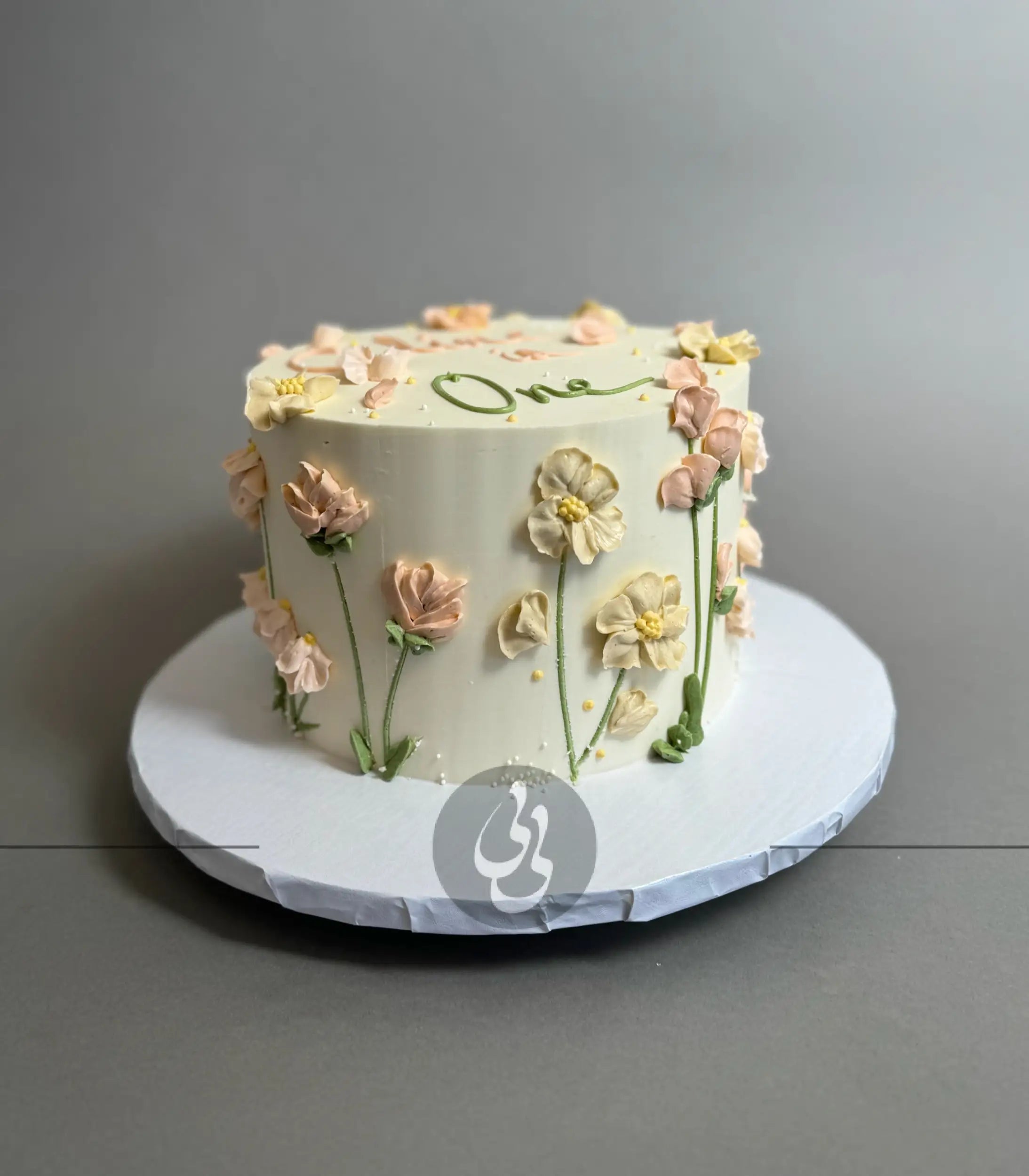 Hand piped flower meadow - custom cake