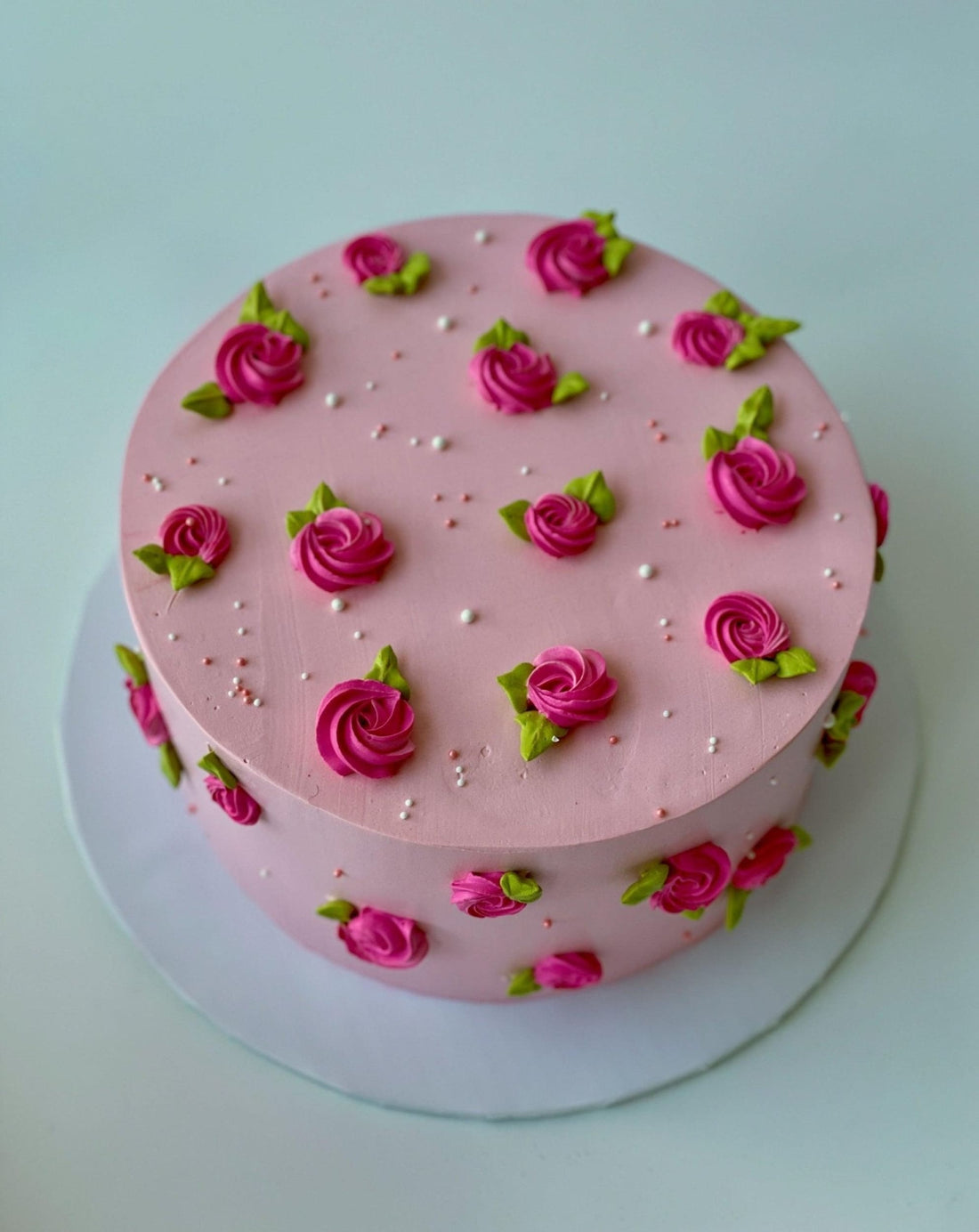 Hand piped mini rosettes on whipped cream - custom cake