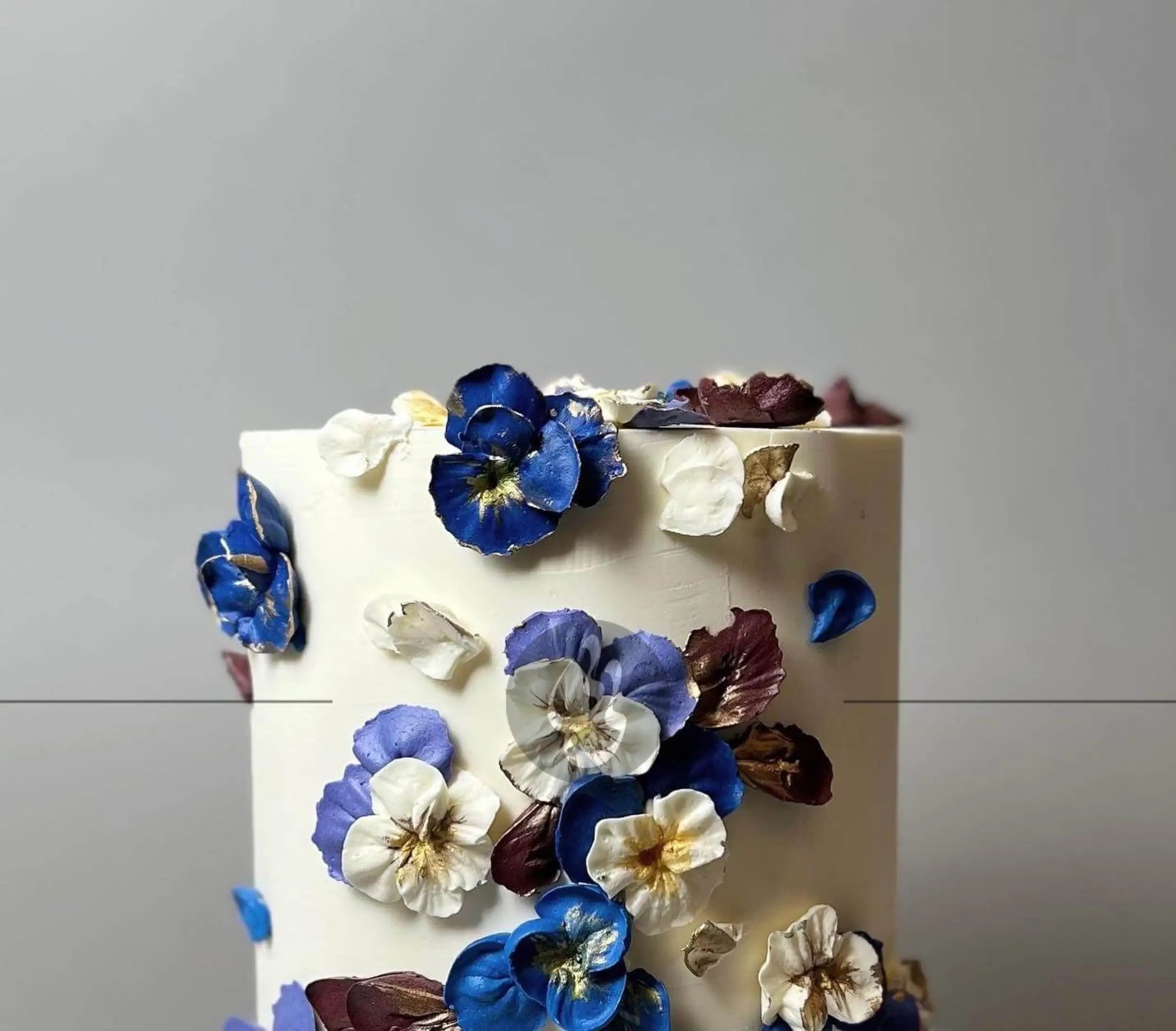 Hand piped pansy flowers on buttercream - custom cake