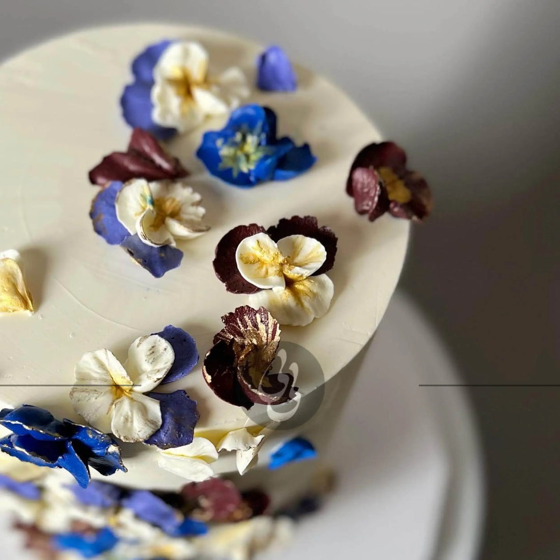 Hand piped pansy flowers on buttercream - custom cake