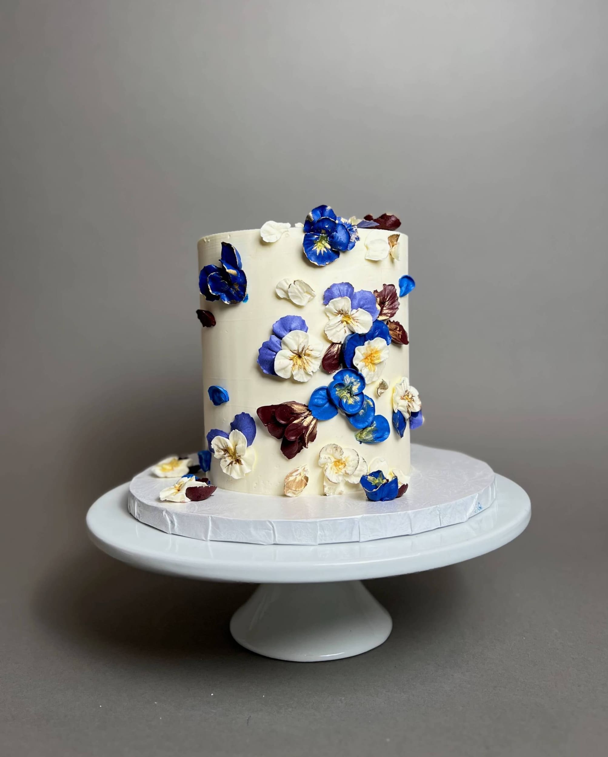 Hand piped pansy flowers on buttercream - custom cake