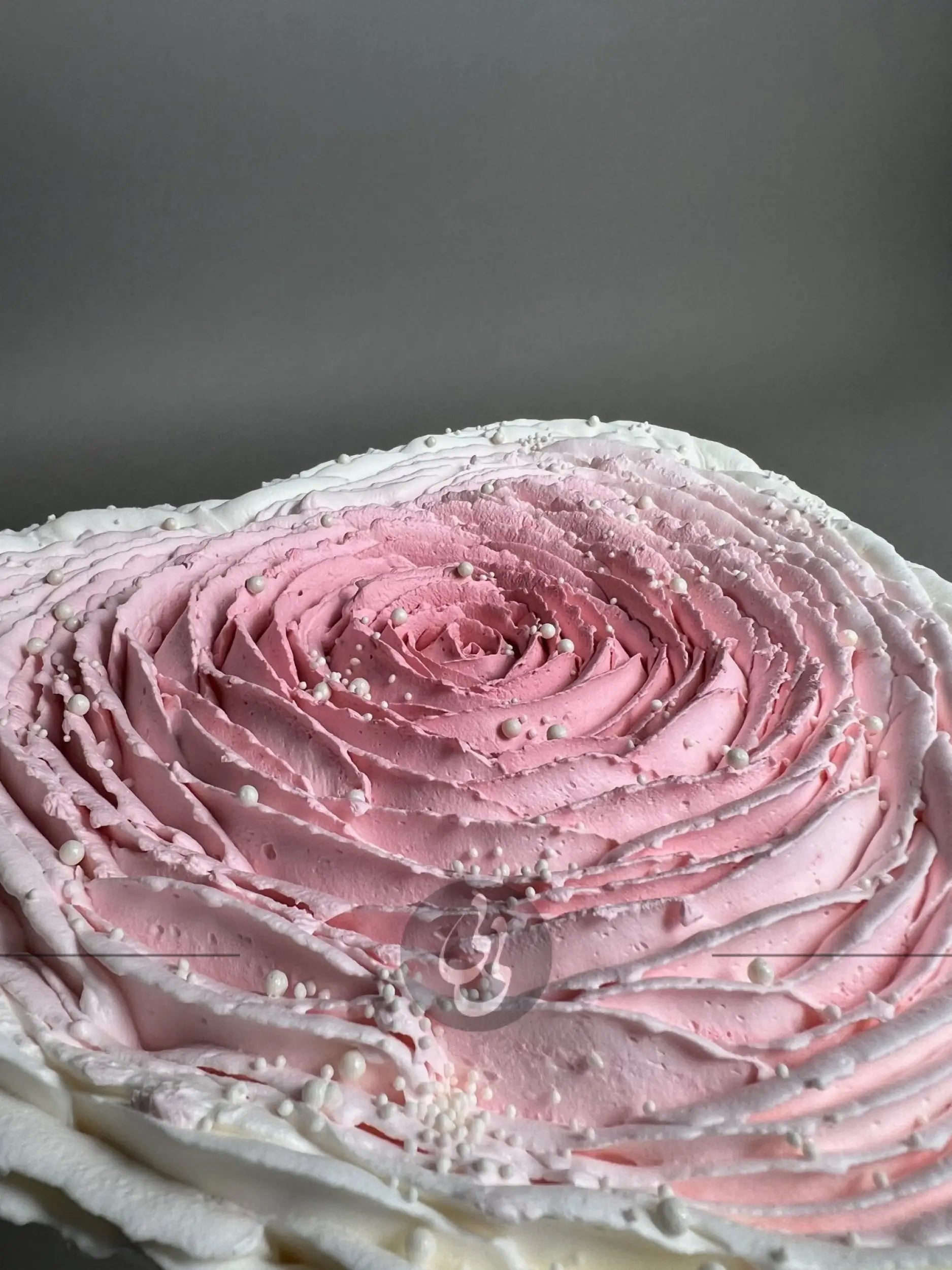 Hand piped ruffled rose on whipped cream heart - custom cake