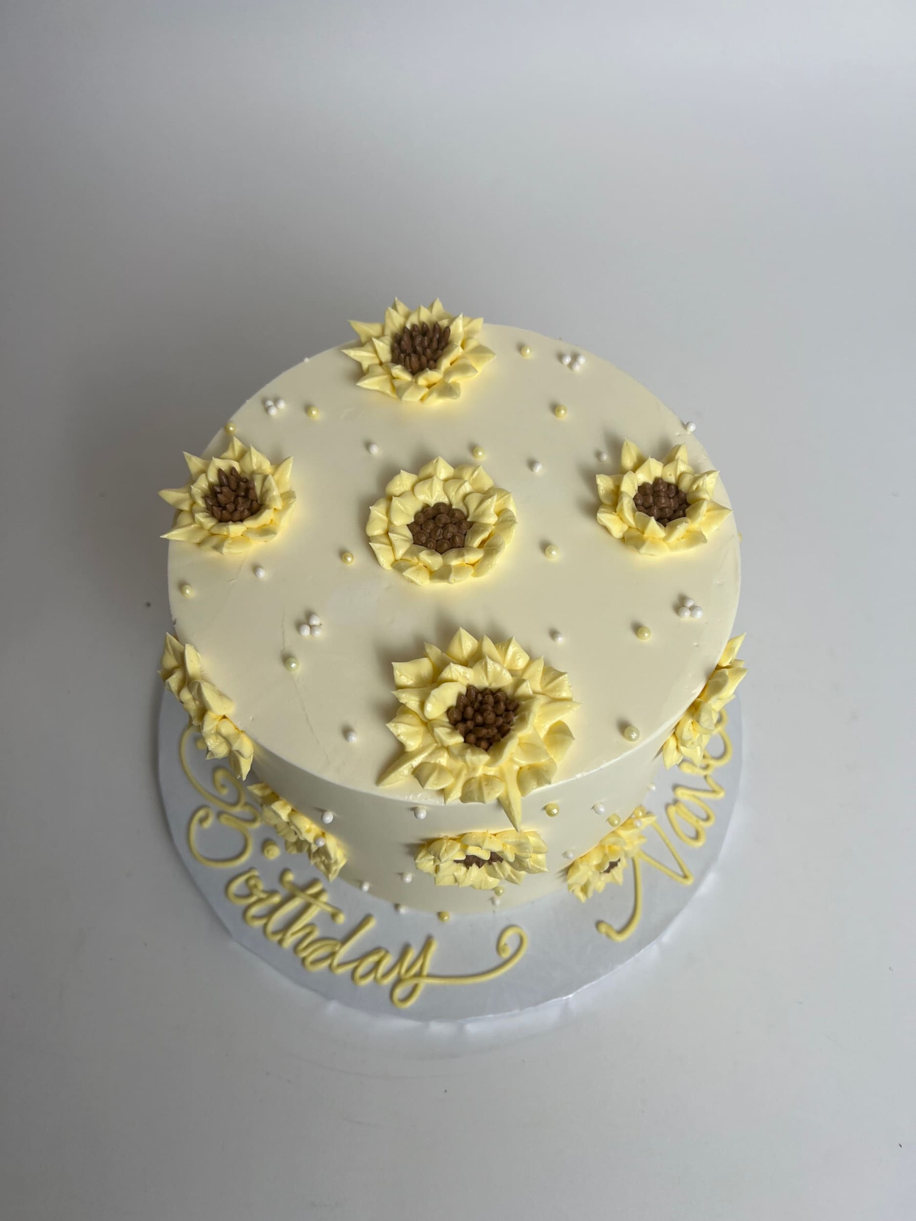 Hand piped sunflowers on buttercream - custom cake