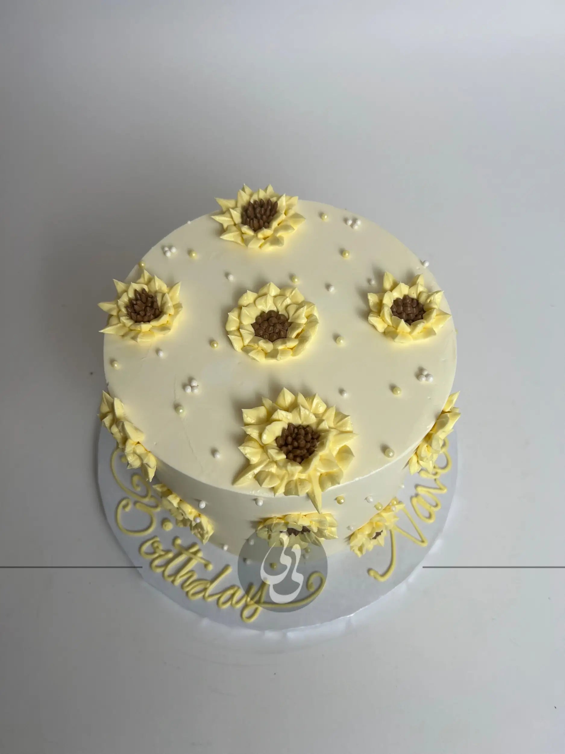 Hand piped sunflowers on buttercream - custom cake