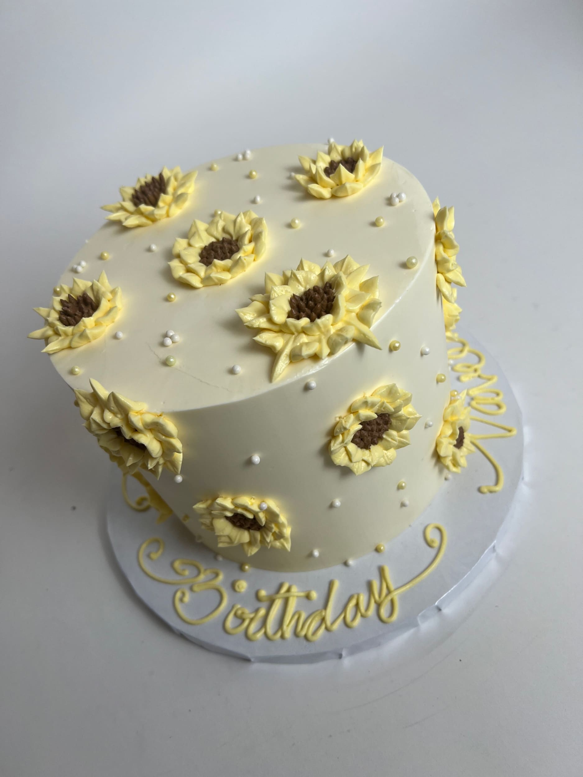 Hand piped sunflowers on buttercream - custom cake