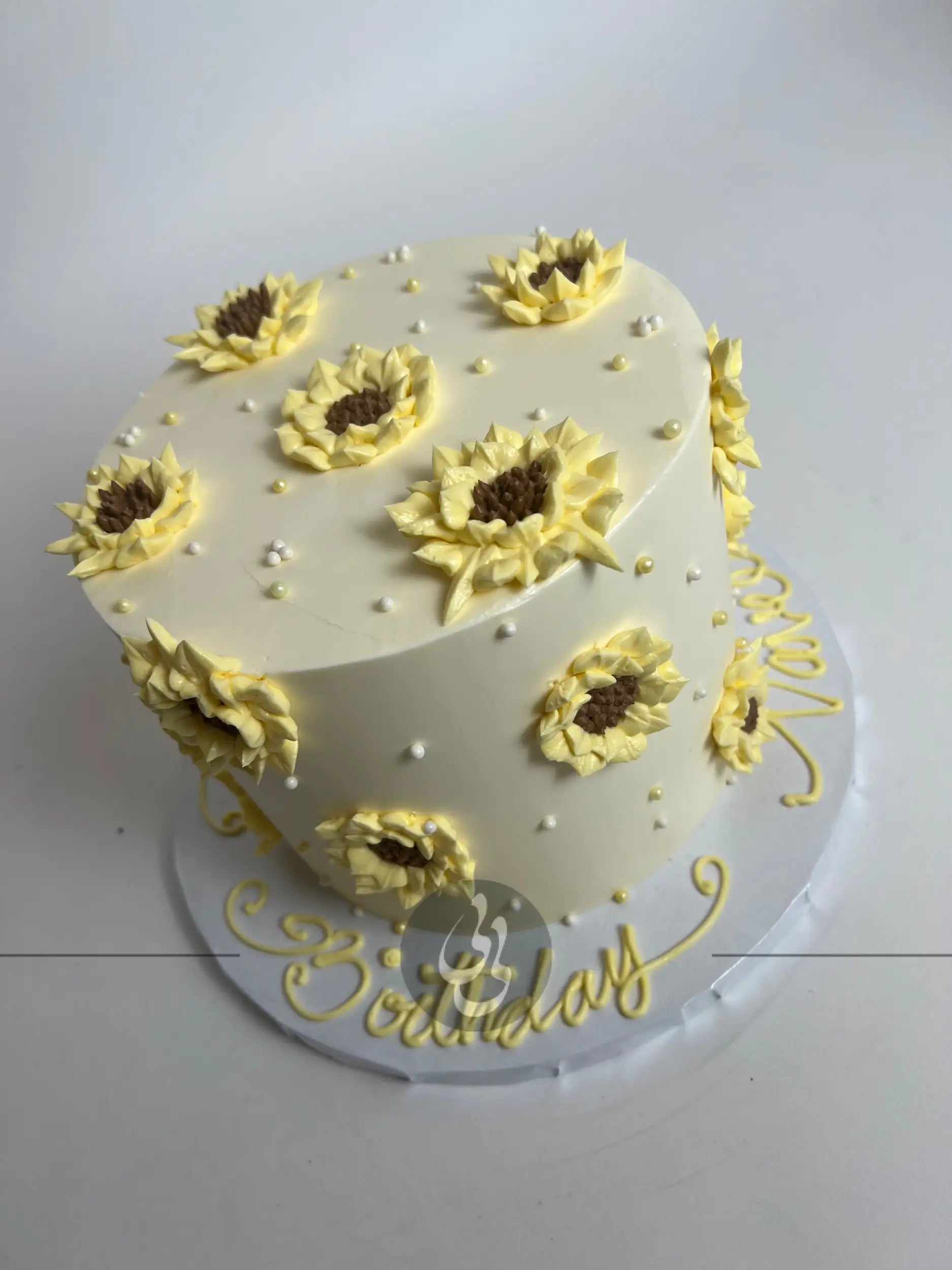 Hand piped sunflowers on buttercream - custom cake