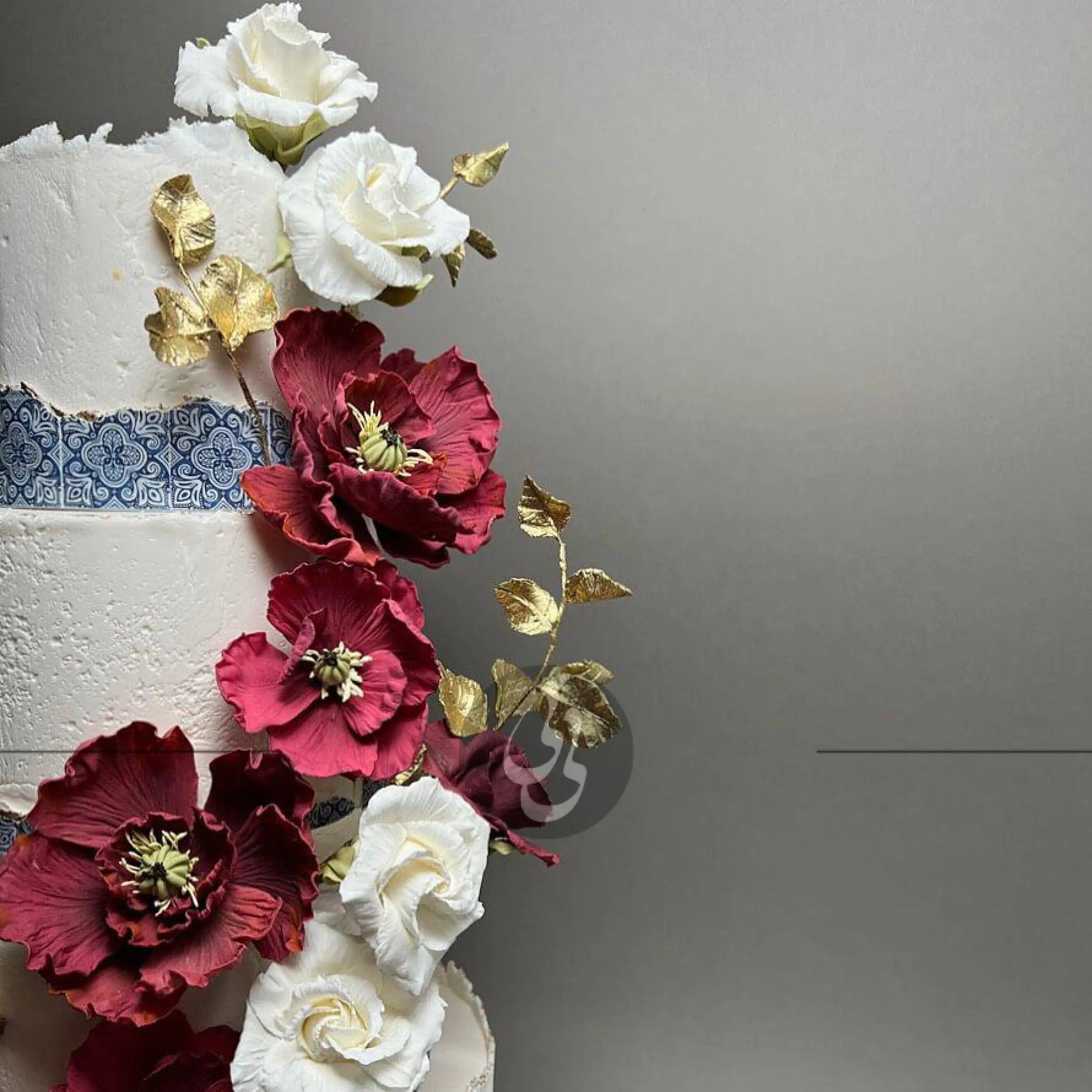 Mediterranean tiles & sugar flowers - wedding cake