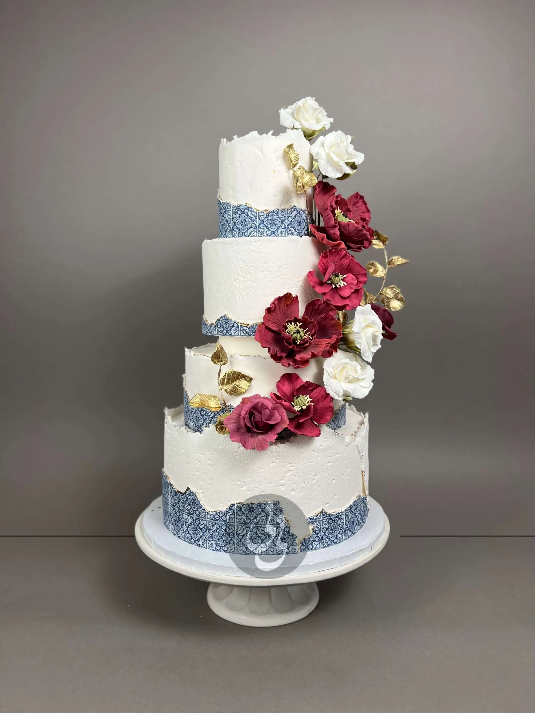 Mediterranean tiles & sugar flowers - wedding cake