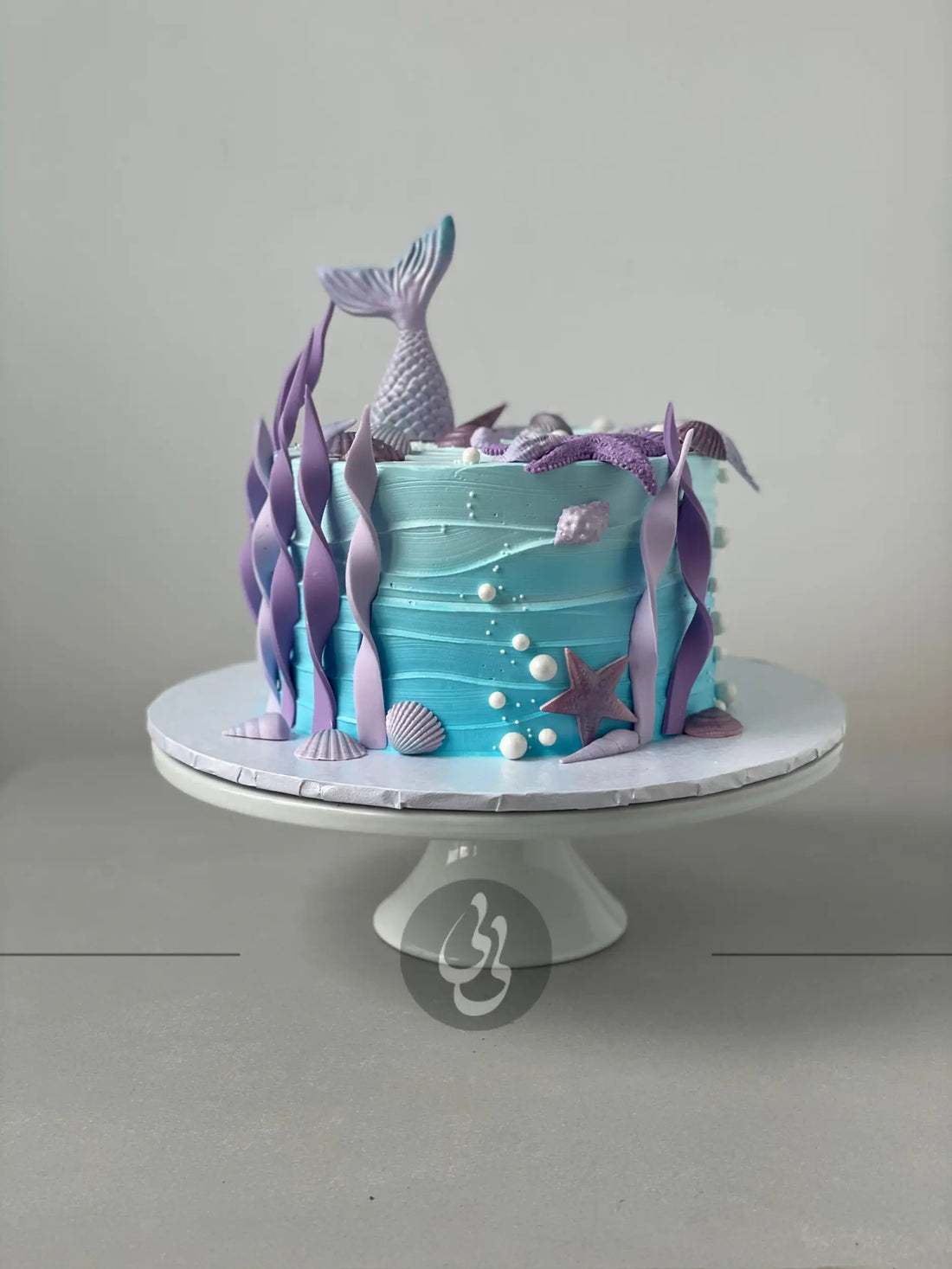 Mermaid tails on buttercream - custom cake