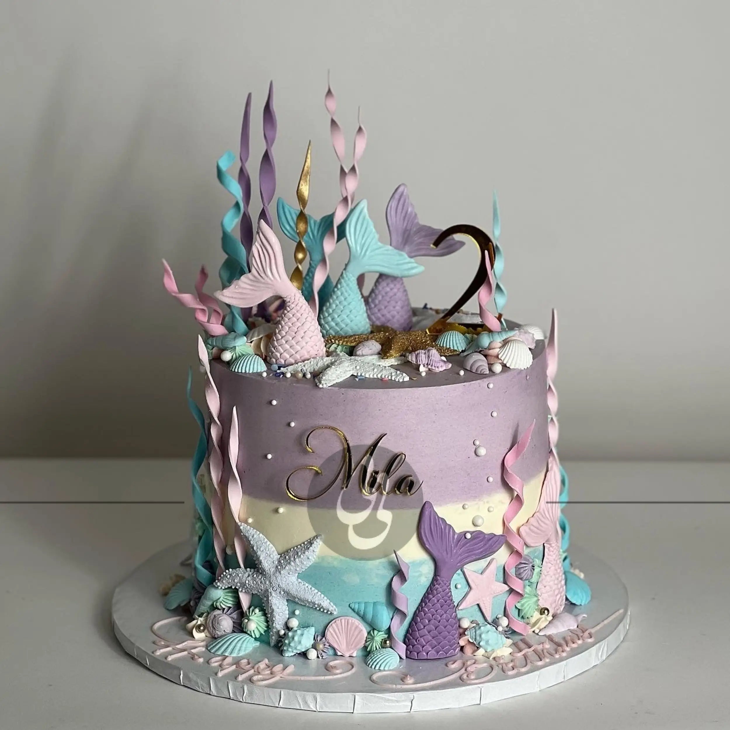 Mermaid tails on buttercream - custom cake