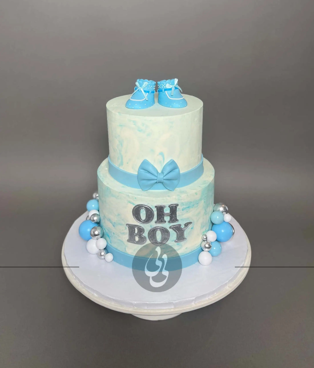 Oh baby booties on marble buttercream - custom cake