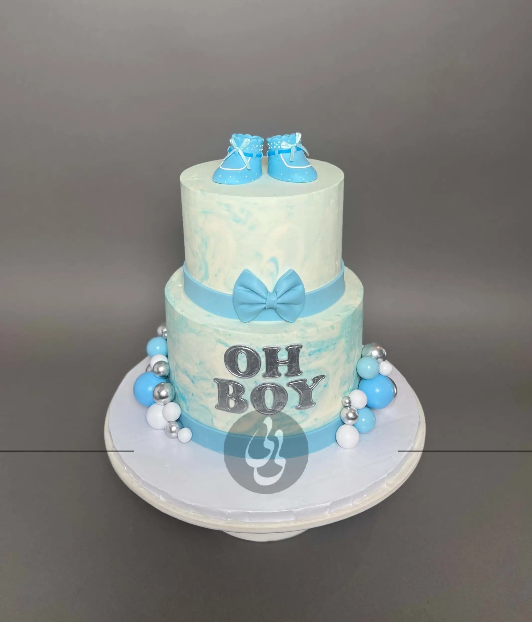 Oh baby booties on marble buttercream - custom cake